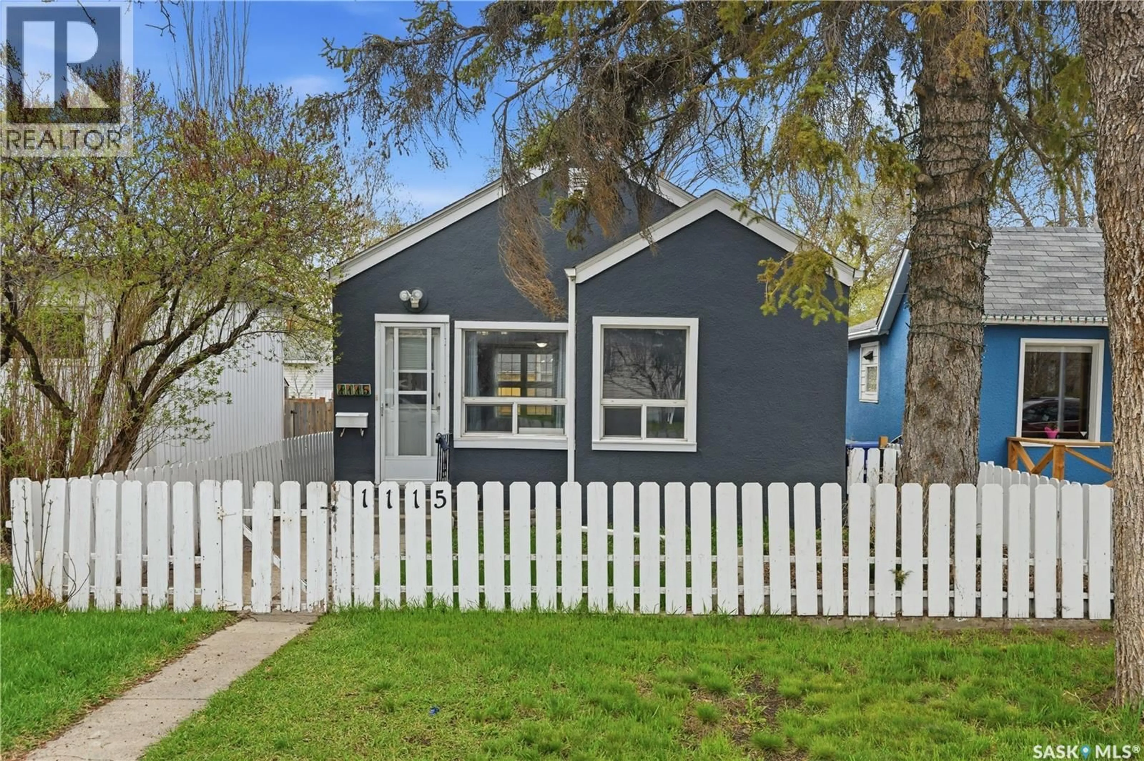 Home with vinyl exterior material, street for 1115 J AVENUE, Saskatoon Saskatchewan S7L2L5