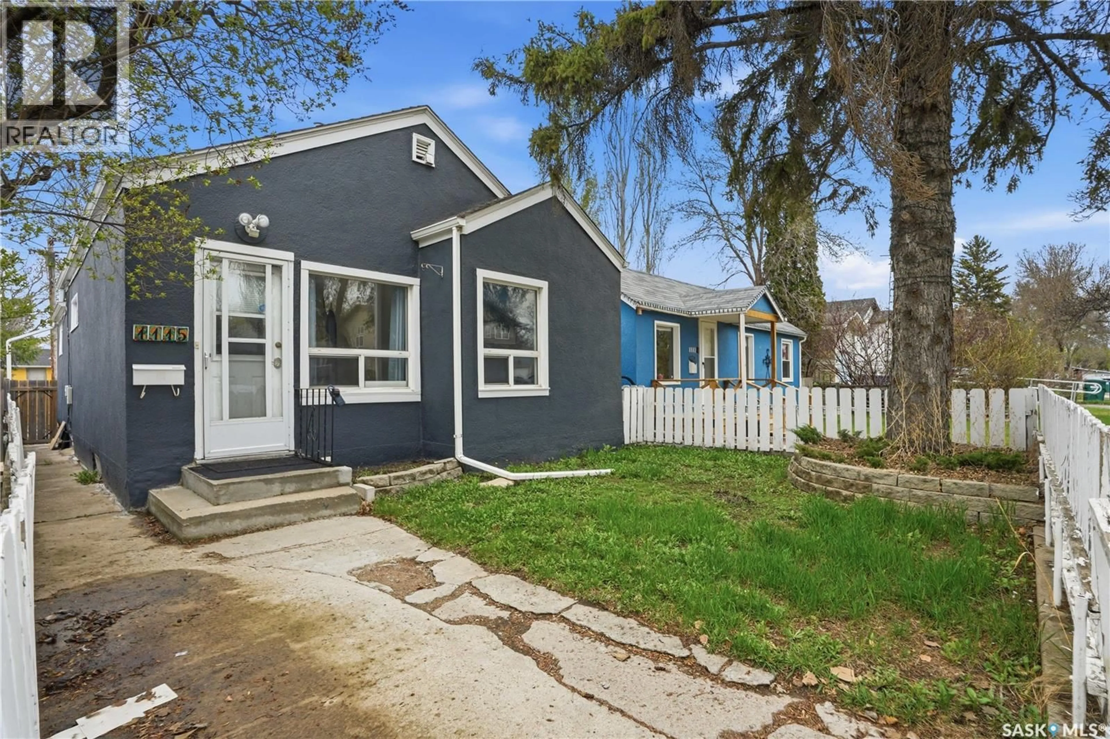 Home with vinyl exterior material, street for 1115 J AVENUE, Saskatoon Saskatchewan S7L2L5