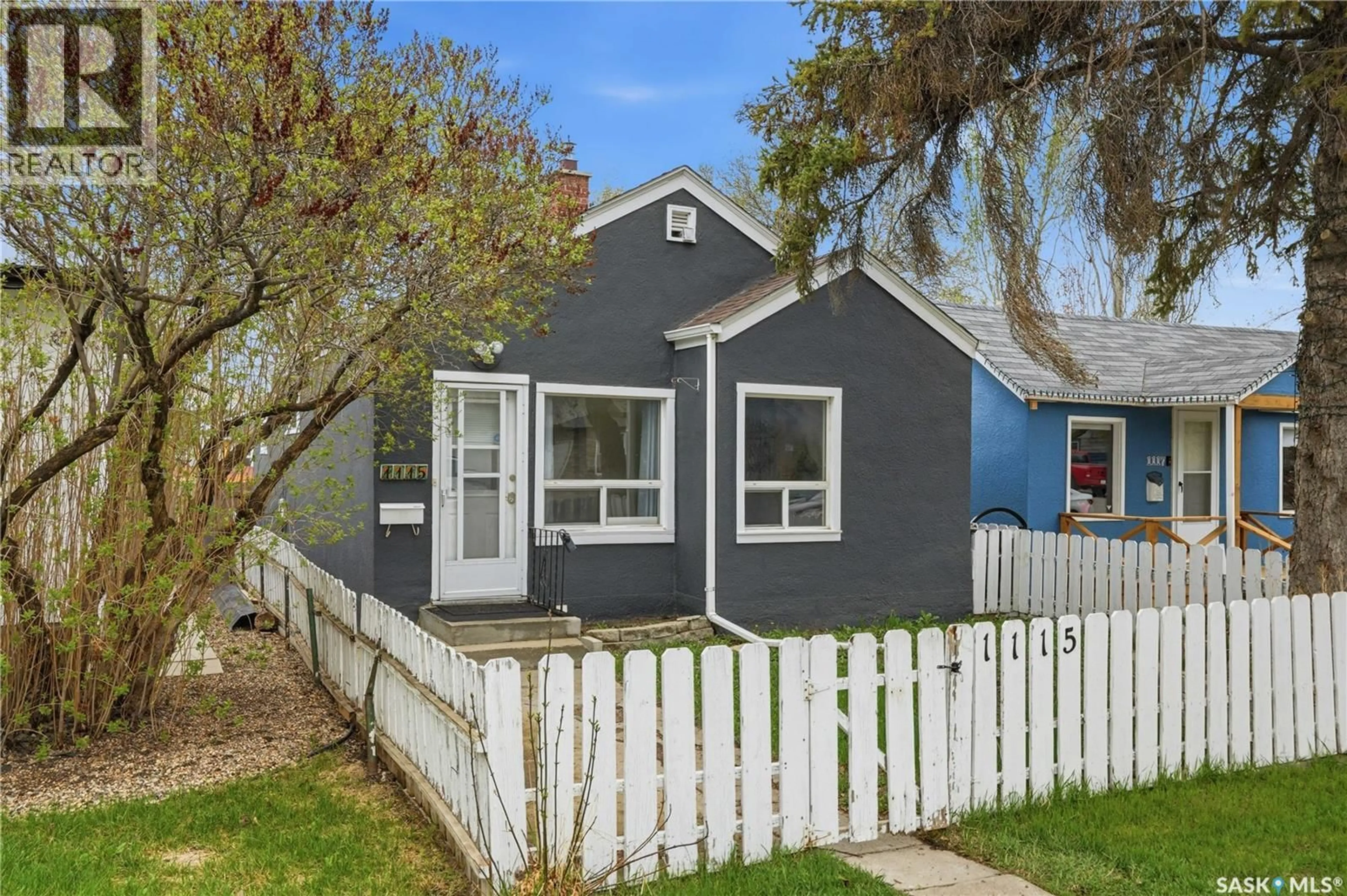 Home with vinyl exterior material, street for 1115 J AVENUE, Saskatoon Saskatchewan S7L2L5