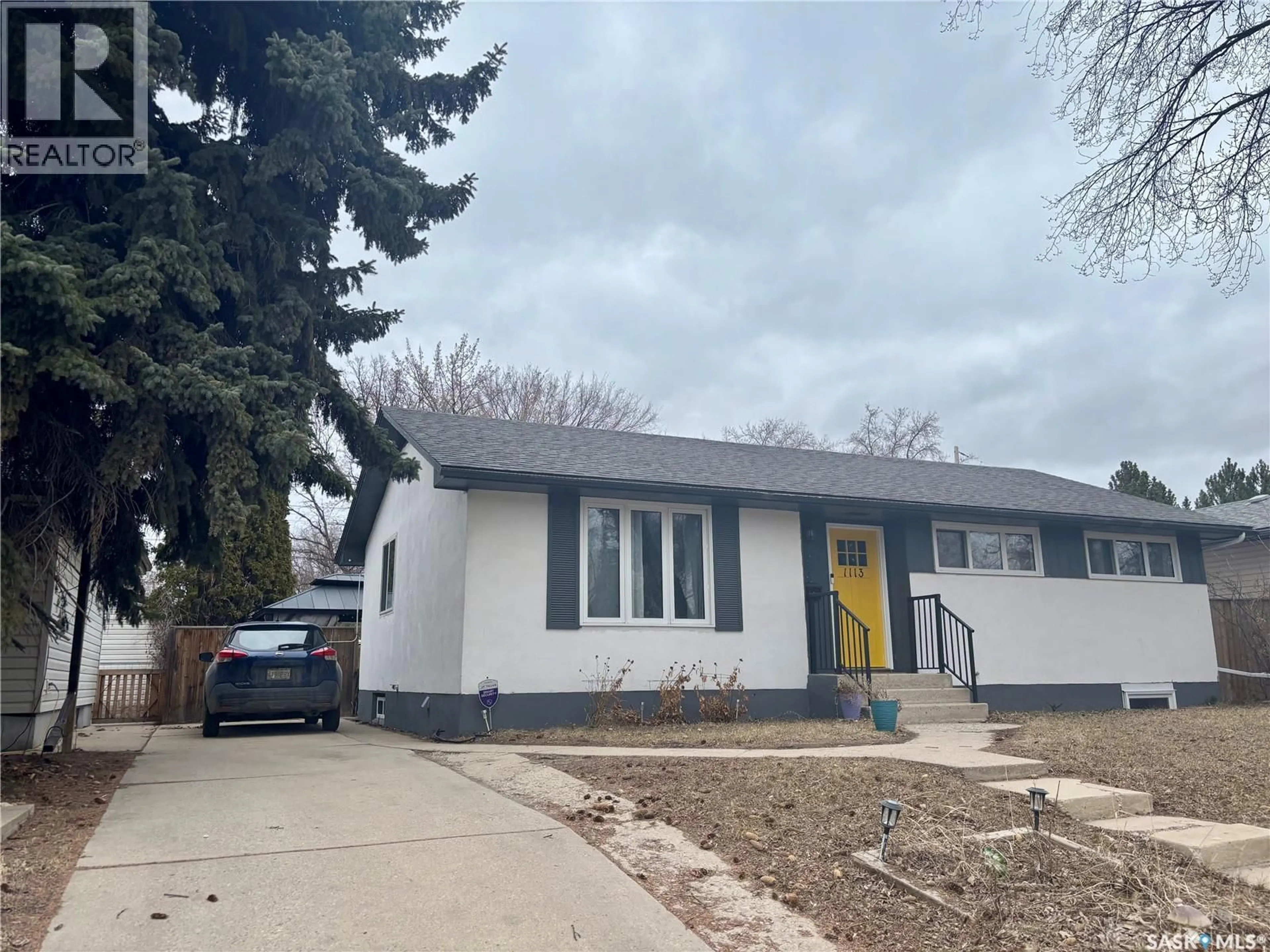 Home with vinyl exterior material, street for 1113 WILSON CRESCENT, Saskatoon Saskatchewan S7J2M7