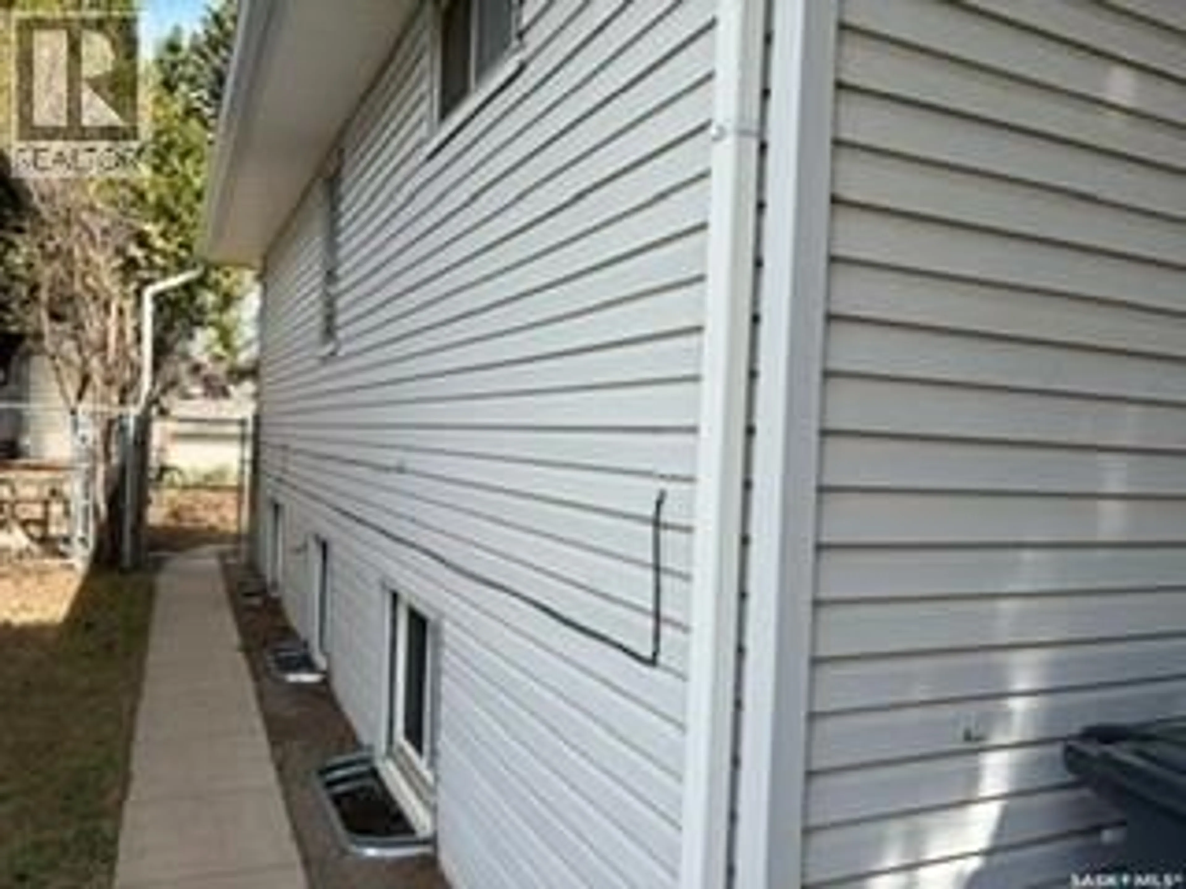 Home with vinyl exterior material, street for 1323 MAIN STREET, Saskatoon Saskatchewan S7H0L3