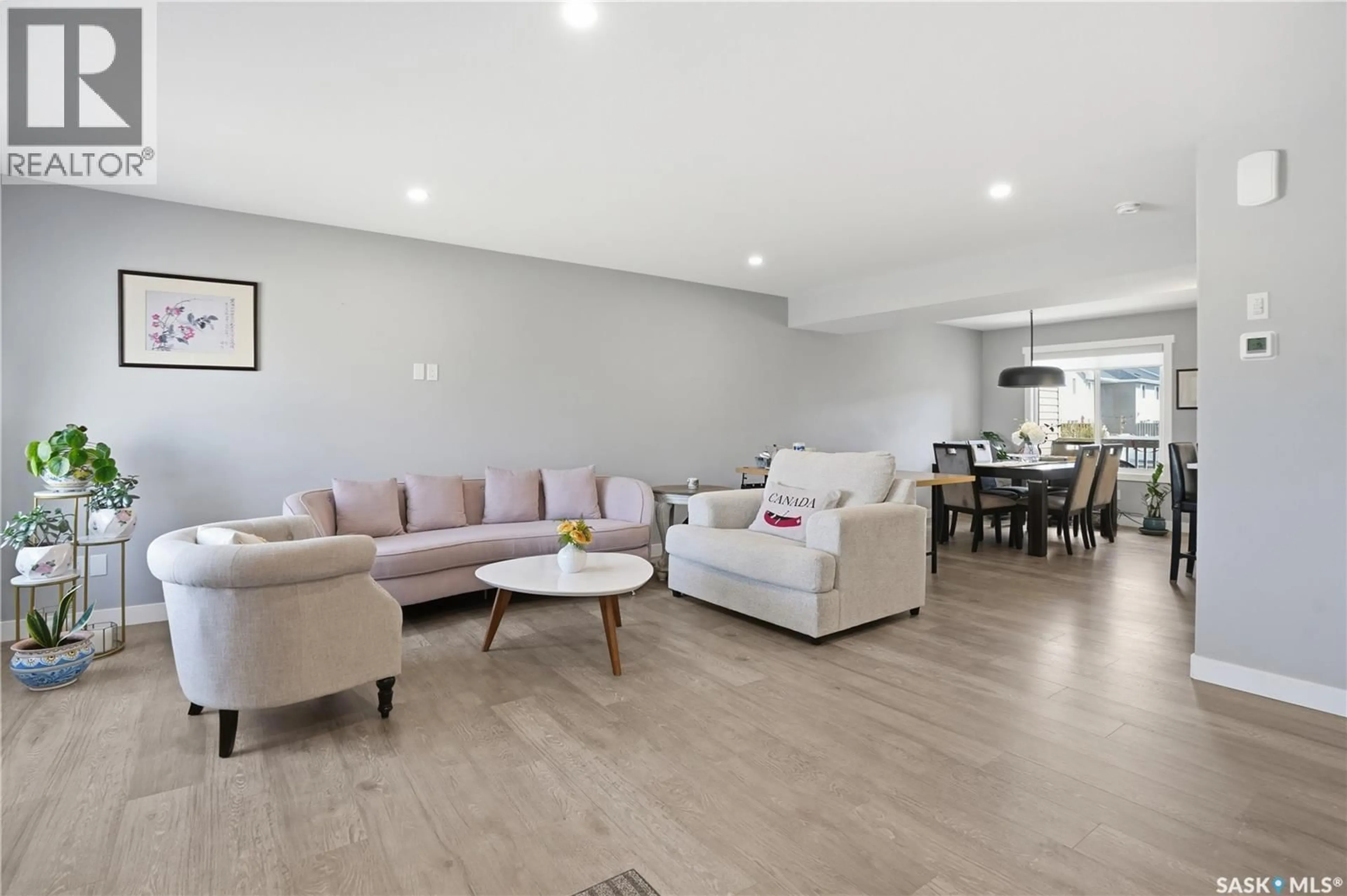 Living room with furniture, wood/laminate floor for 4521 KELLER AVENUE, Regina Saskatchewan S4V3R3