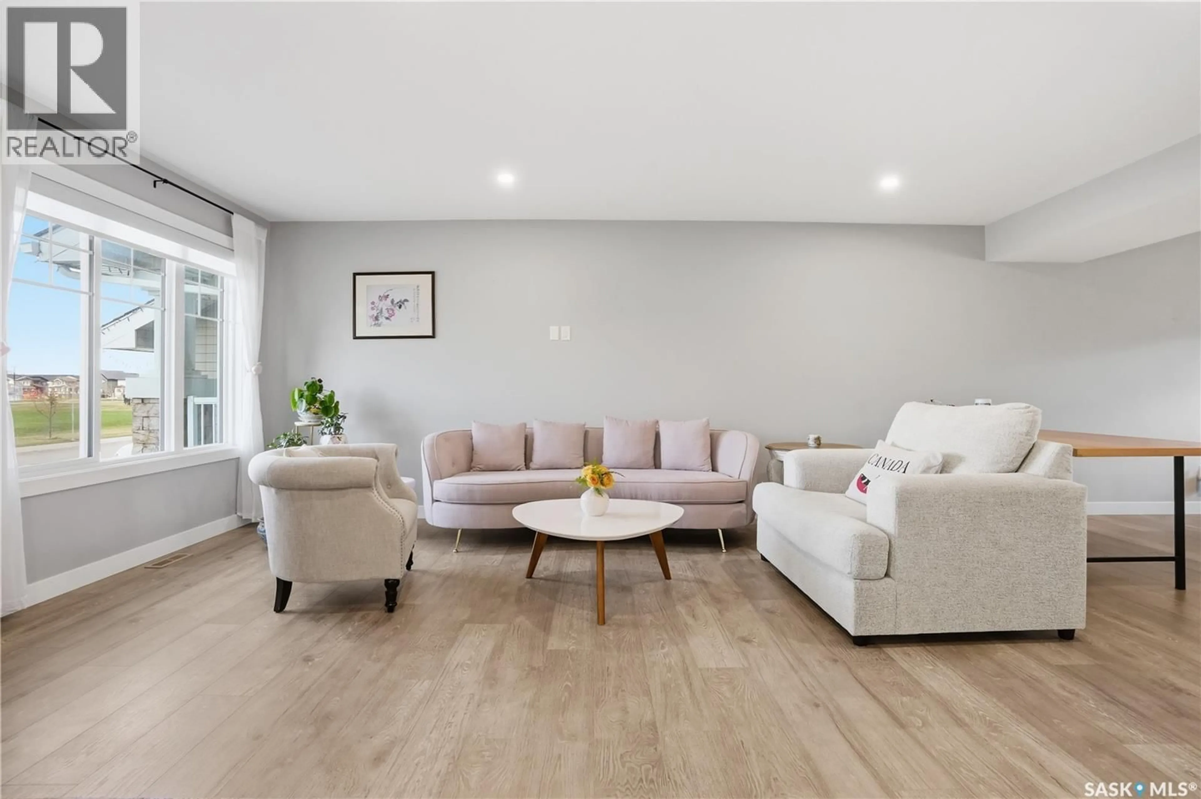 Living room with furniture, wood/laminate floor for 4521 KELLER AVENUE, Regina Saskatchewan S4V3R3