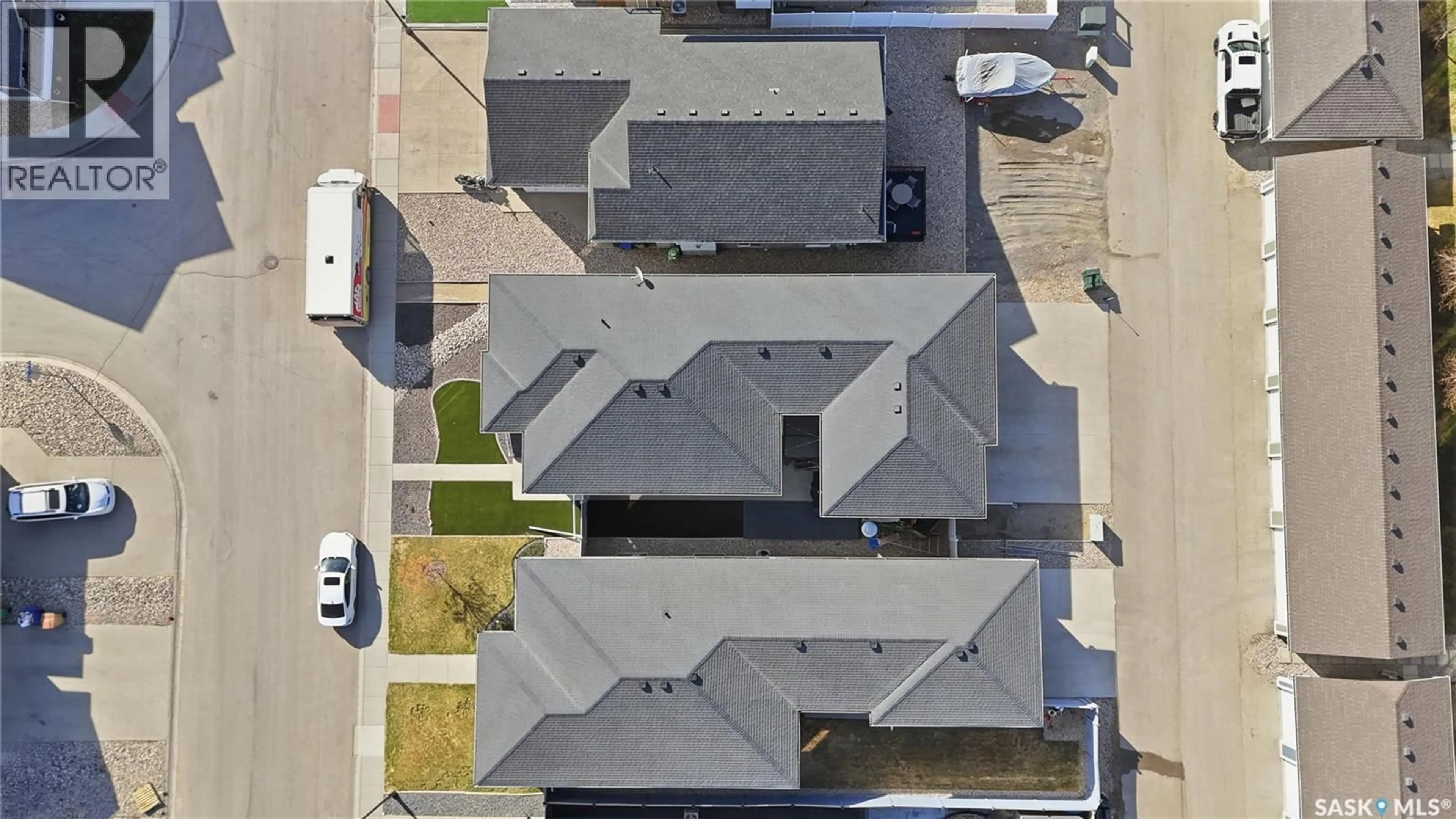 A pic from outside/outdoor area/front of a property/back of a property/a pic from drone, street for E - 4202 GREEN OLIVE WAY, Regina Saskatchewan S4V1P8