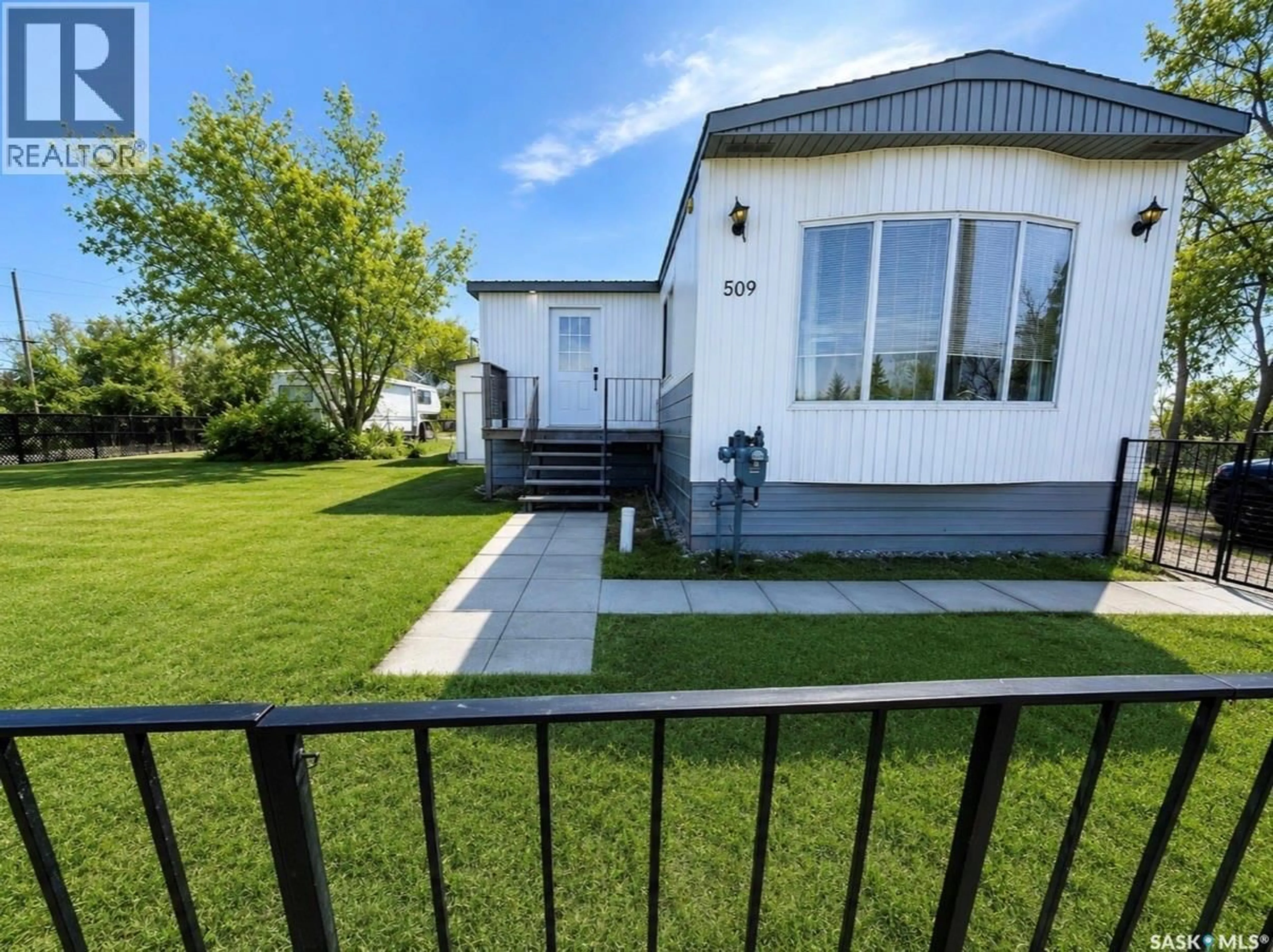 A pic from outside/outdoor area/front of a property/back of a property/a pic from drone, street for 509 TOEWS STREET, Morse Saskatchewan S0H3C0