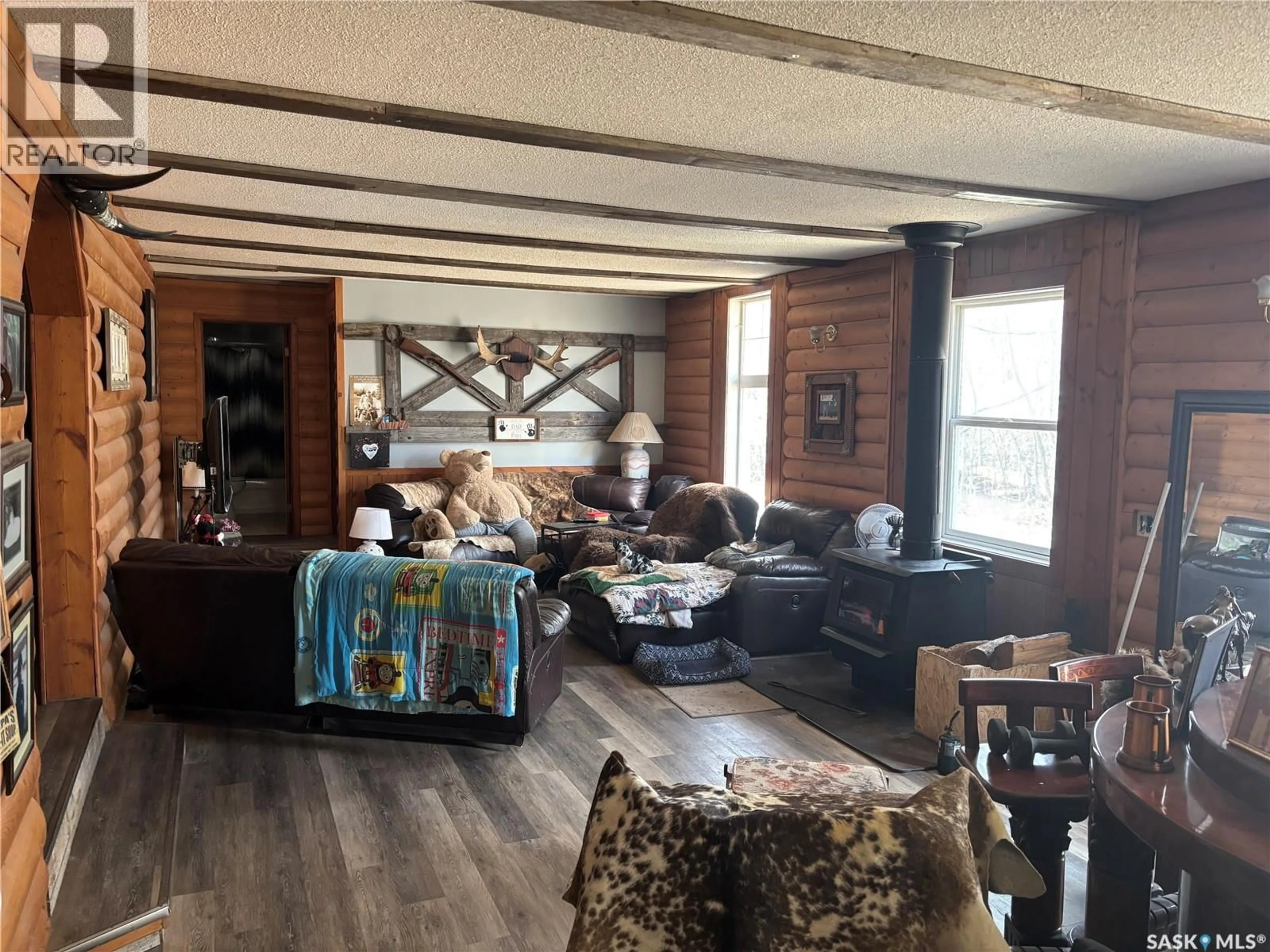 Living room with furniture, wood/laminate floor for ACREAGE NEAR TISDALE HIGHWAY, Bjorkdale Rm No. 426 Saskatchewan S0E0R0