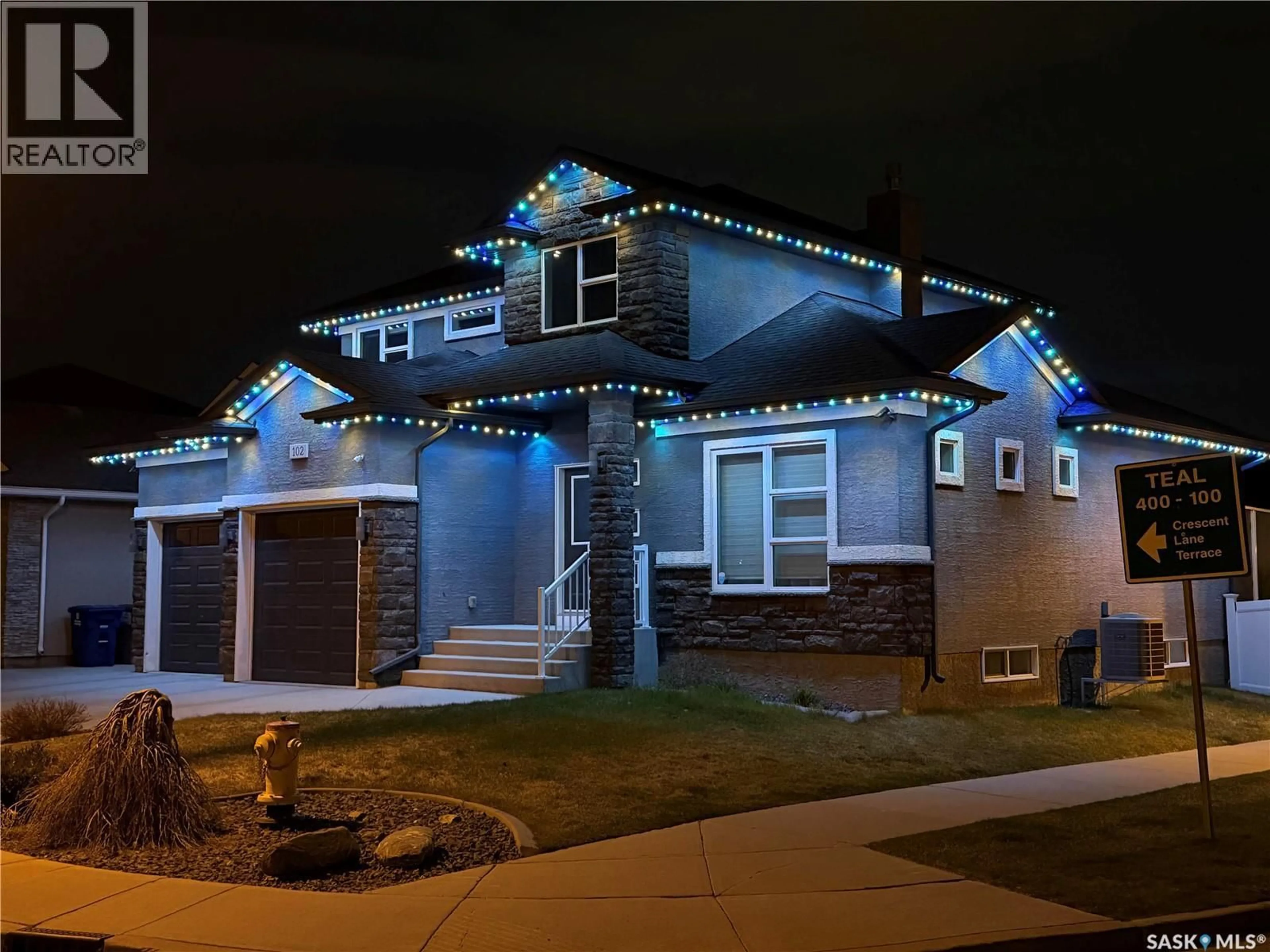Home with vinyl exterior material, street for 102 TEAL CRESCENT, Saskatoon Saskatchewan S7T0P9