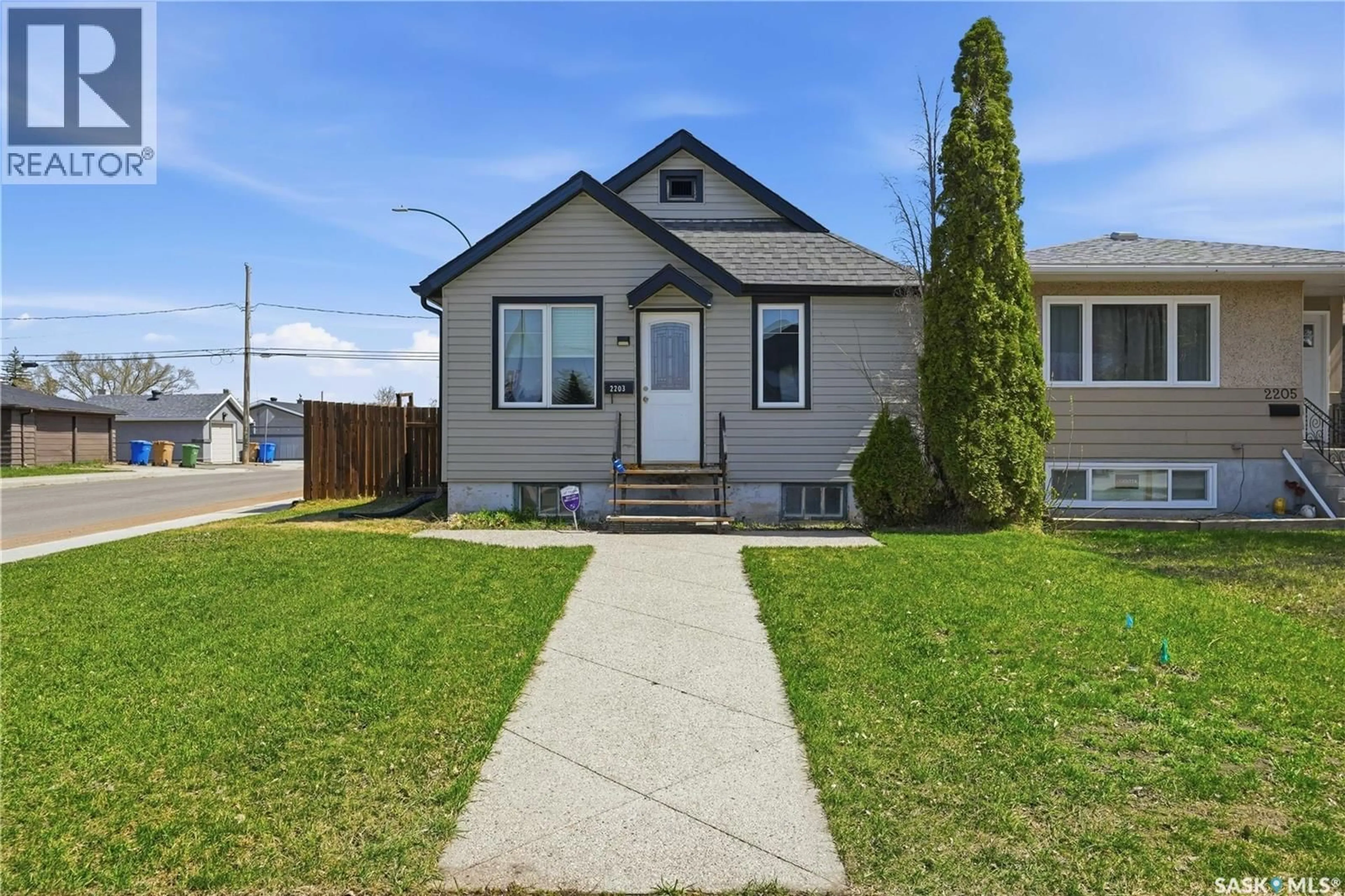 Home with vinyl exterior material, street for 2203 LINDSAY STREET, Regina Saskatchewan S4N3C2