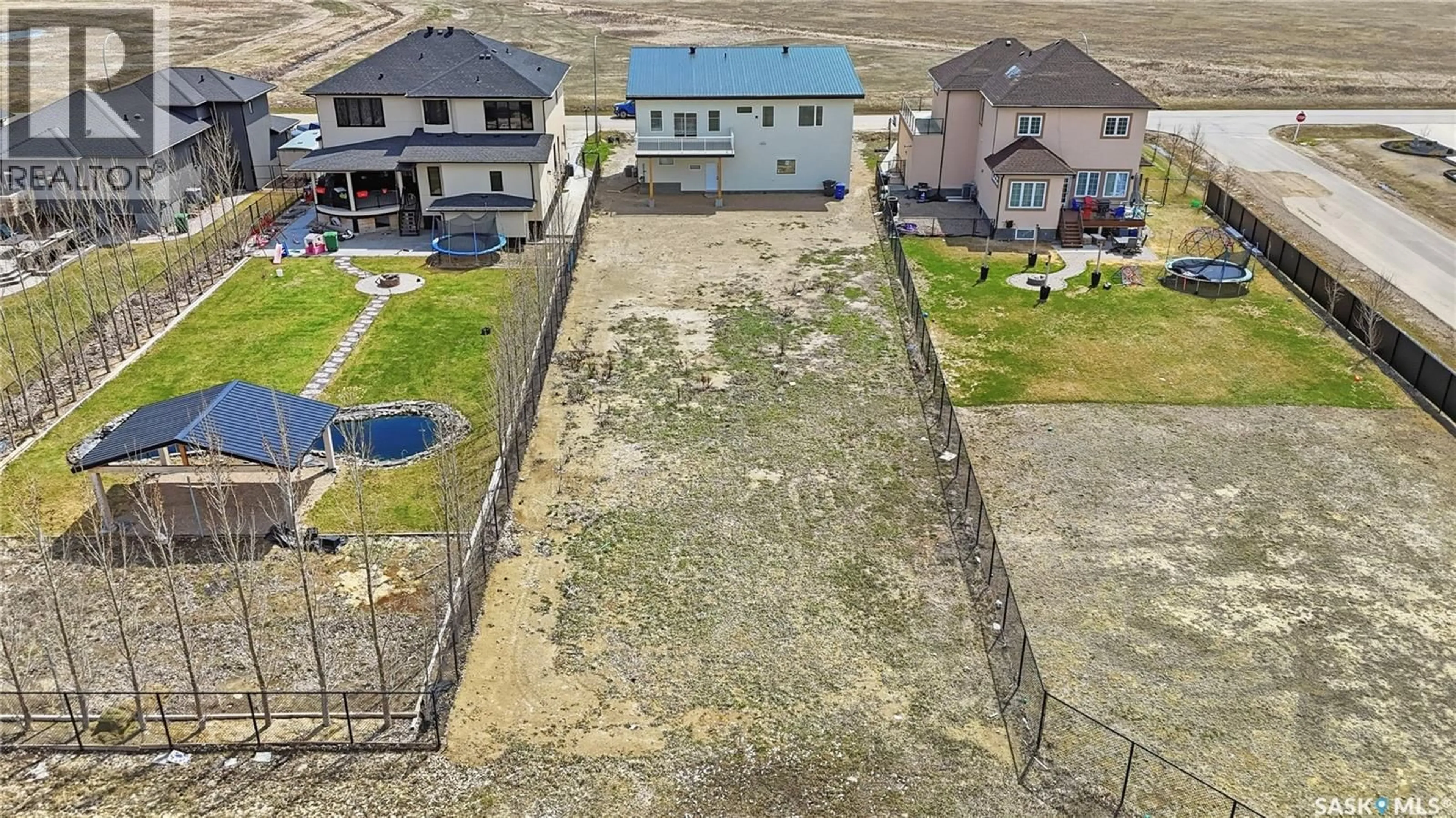 A pic from outside/outdoor area/front of a property/back of a property/a pic from drone, street for 716 EMERALD PARK ROAD, Edenwold Rm No.158 Saskatchewan S4L0C4
