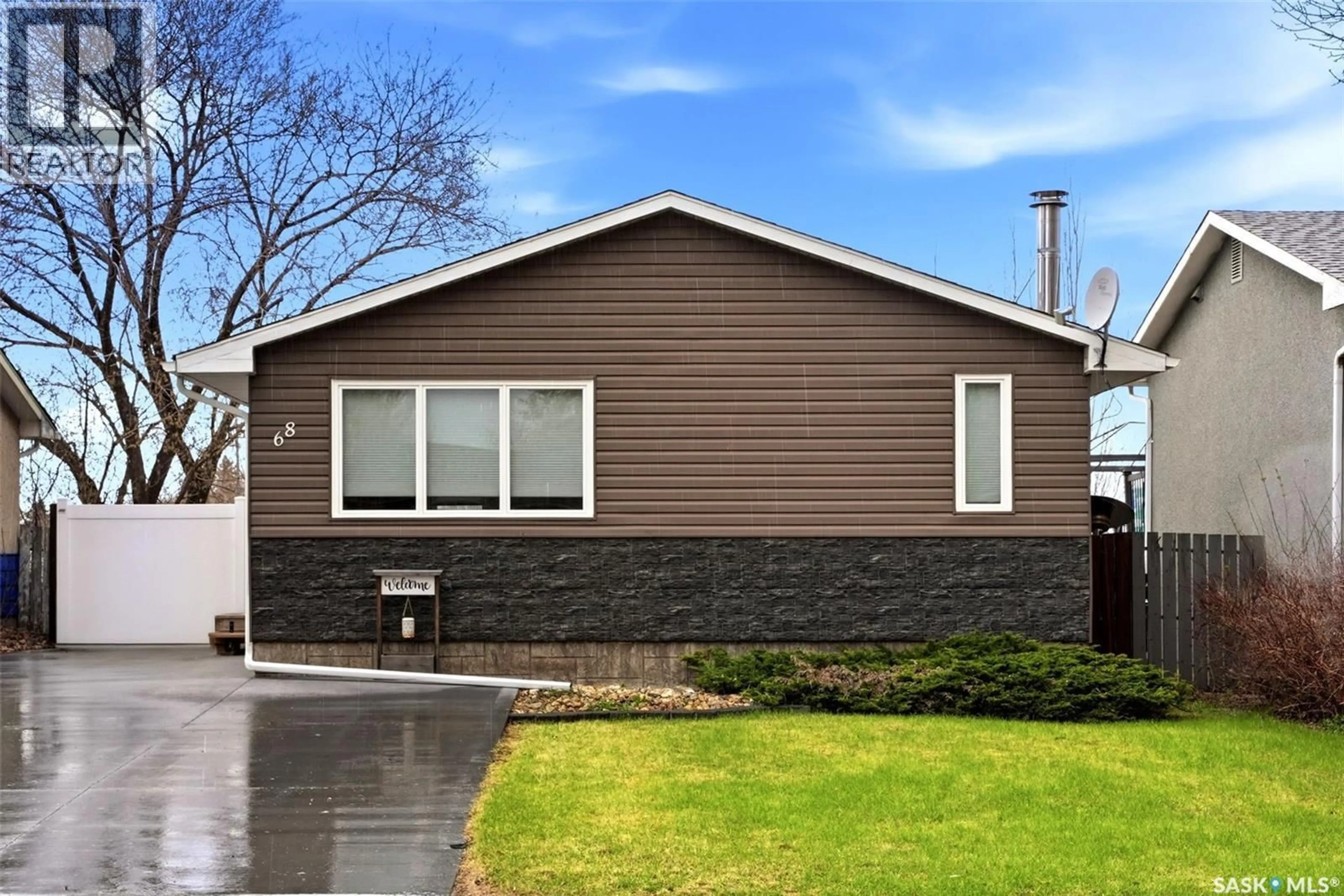 Home with vinyl exterior material, street for 68 CARMICHAEL ROAD, Regina Saskatchewan S4R0C5