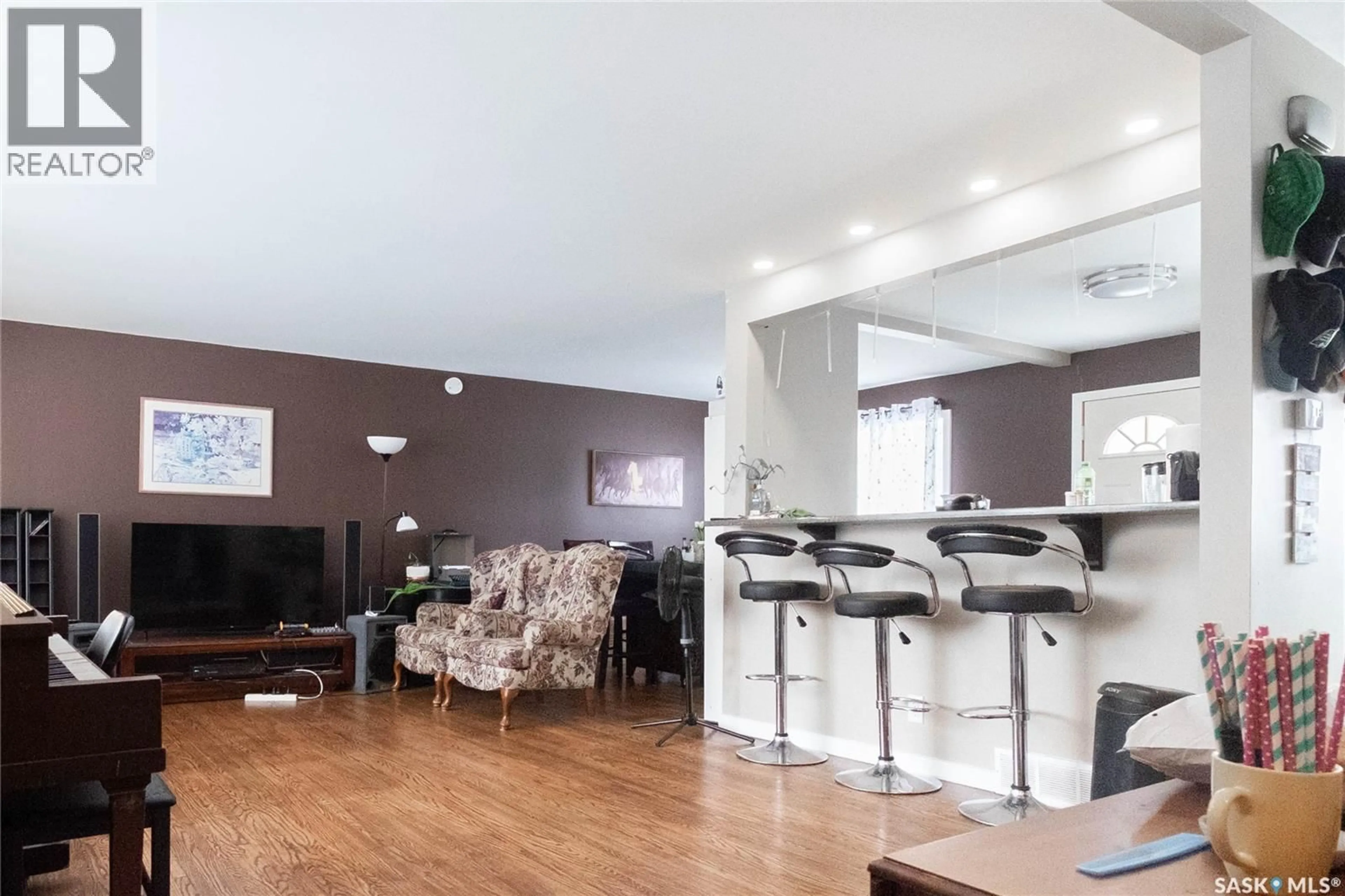 Living room with furniture, wood/laminate floor for 92 BELL STREET, Regina Saskatchewan S4S4B9