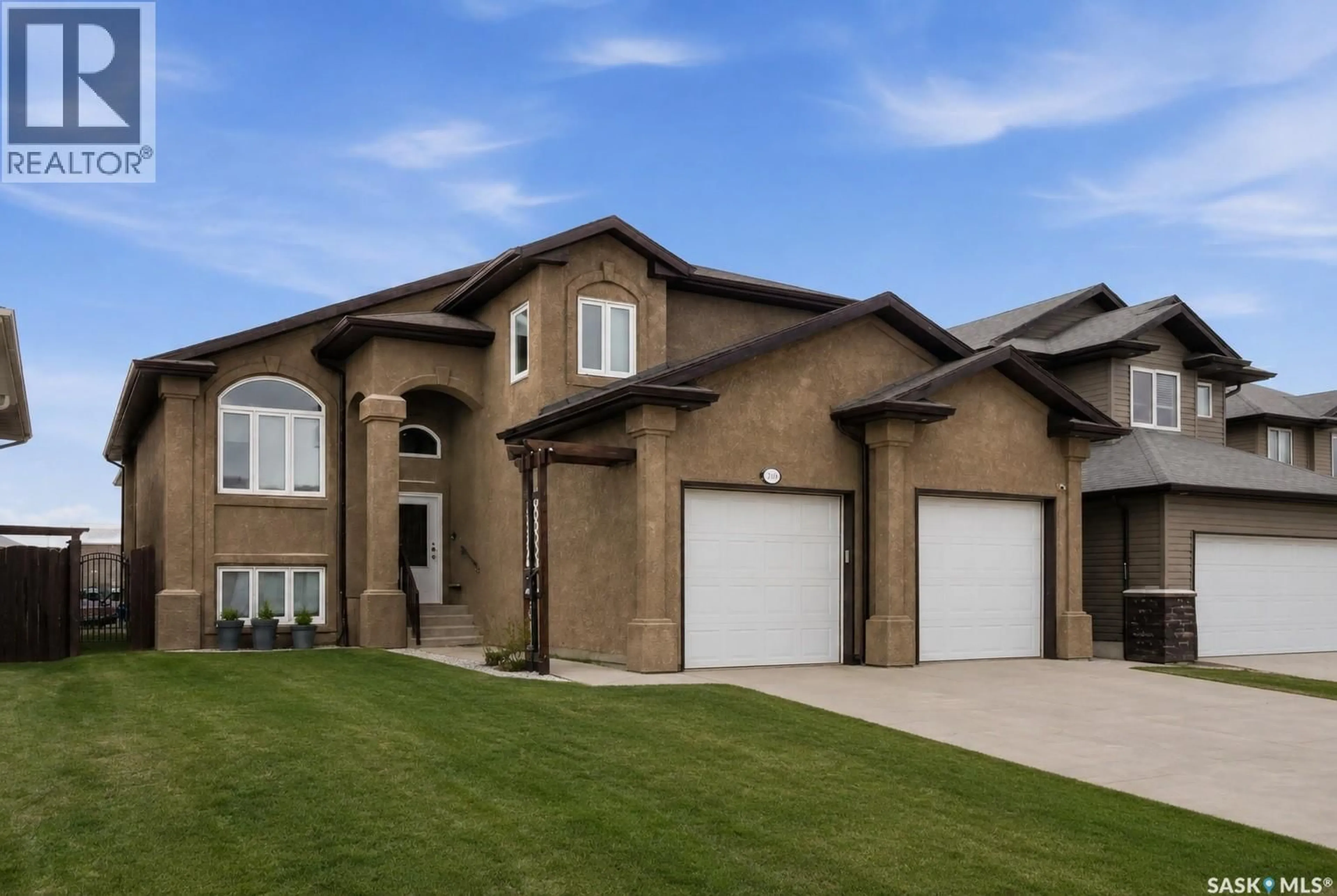 Home with brick exterior material, street for 335 MCCALLUM LANE, Saskatoon Saskatchewan S7R0C3