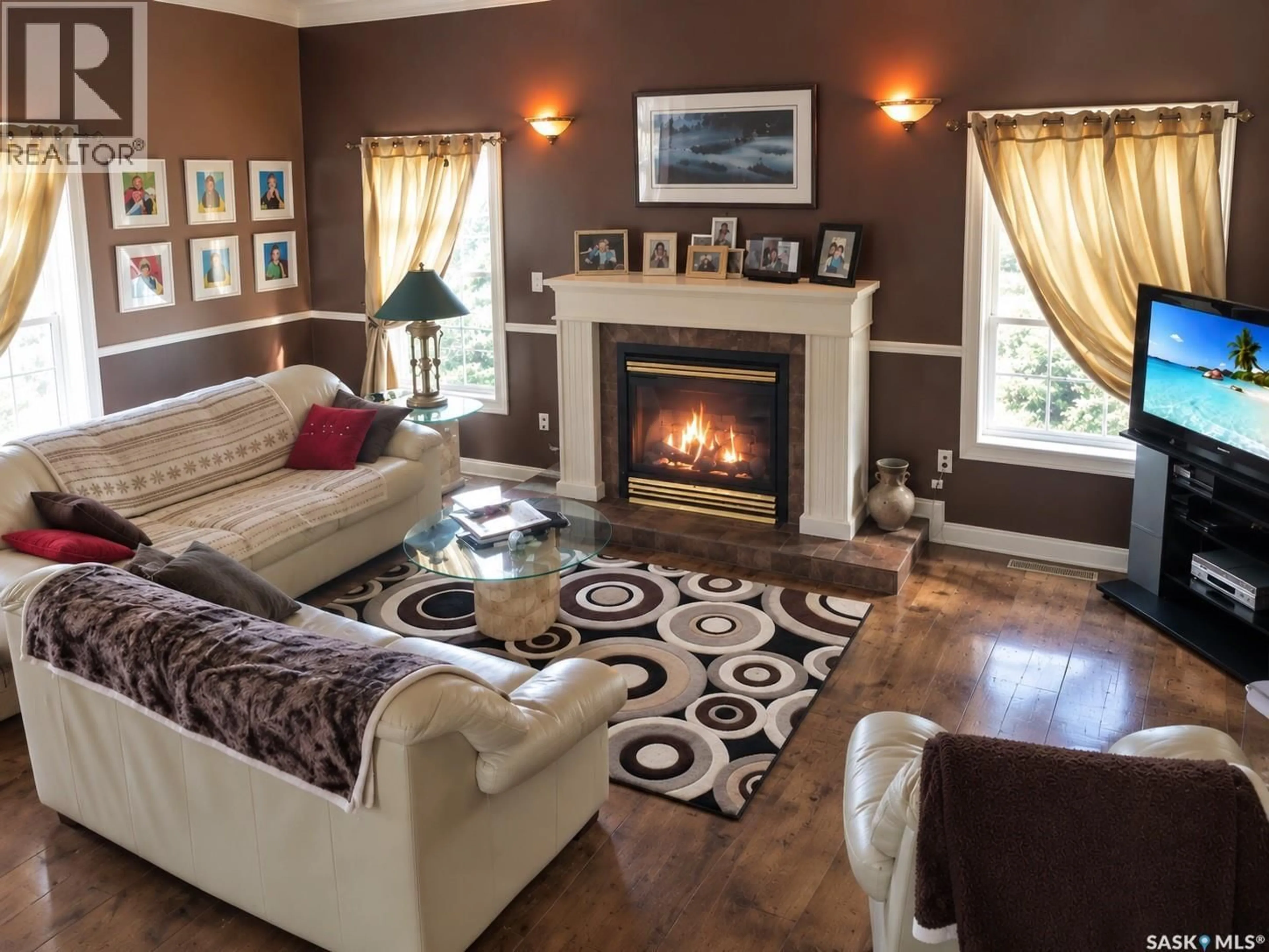 Living room with furniture, wood/laminate floor for 23 265 HIGHWAY, Candle Lake Saskatchewan S0J3E0