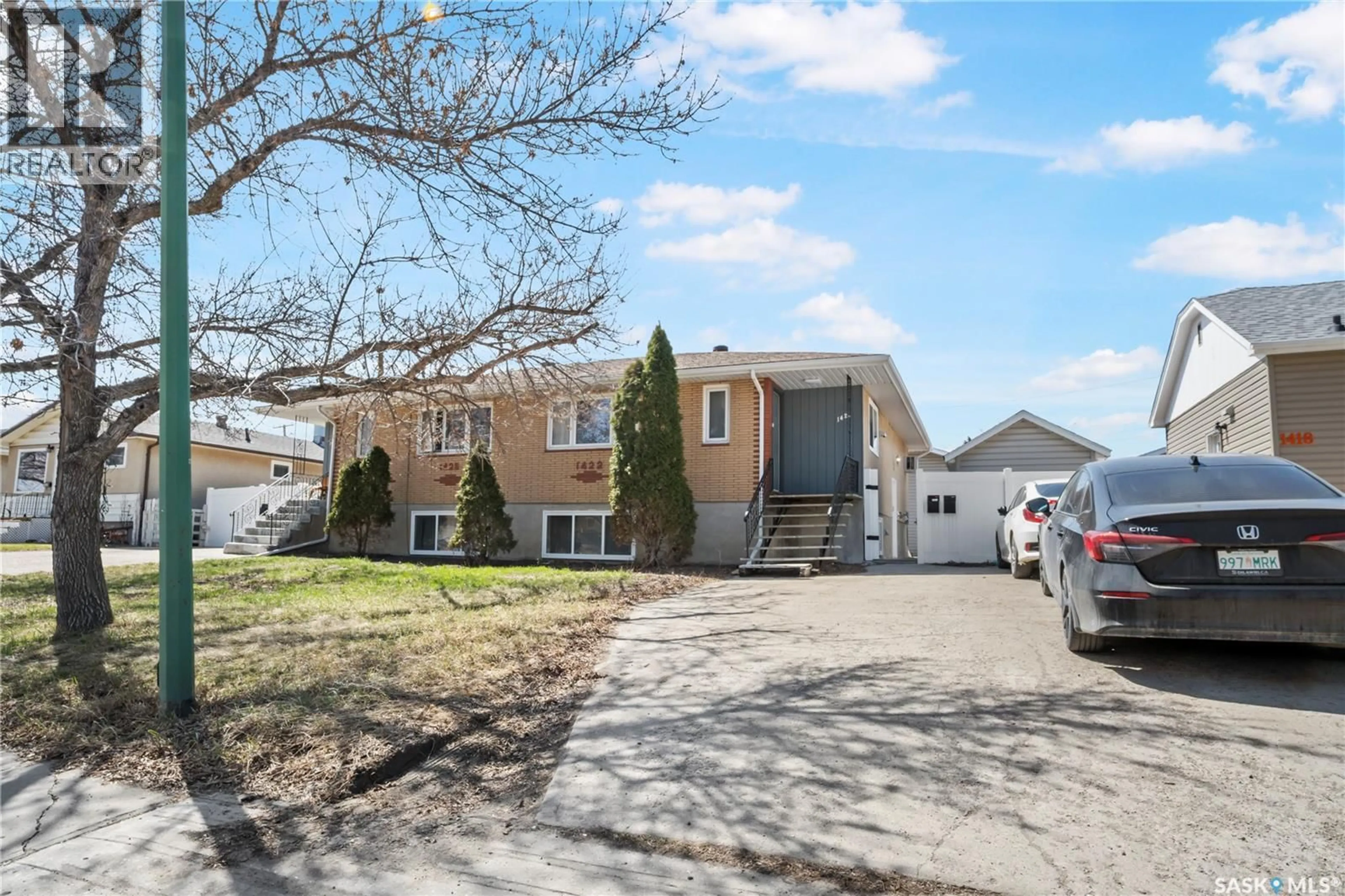 Home with vinyl exterior material, street for 1428 RUPERT STREET, Regina Saskatchewan S4N1V8