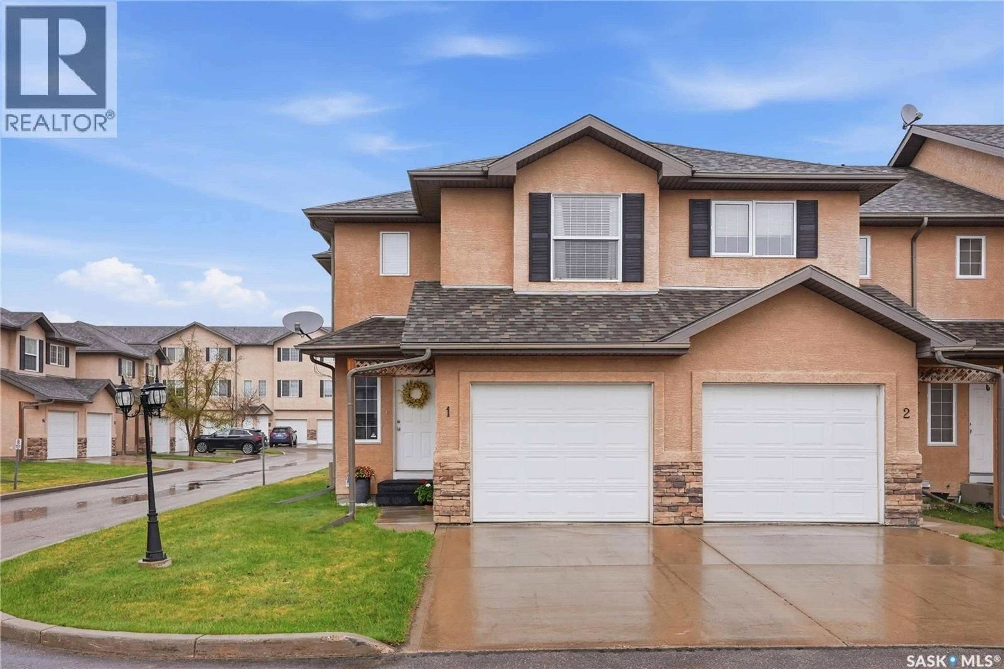 Home with vinyl exterior material, street for 1 118 PAWLYCHENKO LANE, Saskatoon Saskatchewan S7V1K1