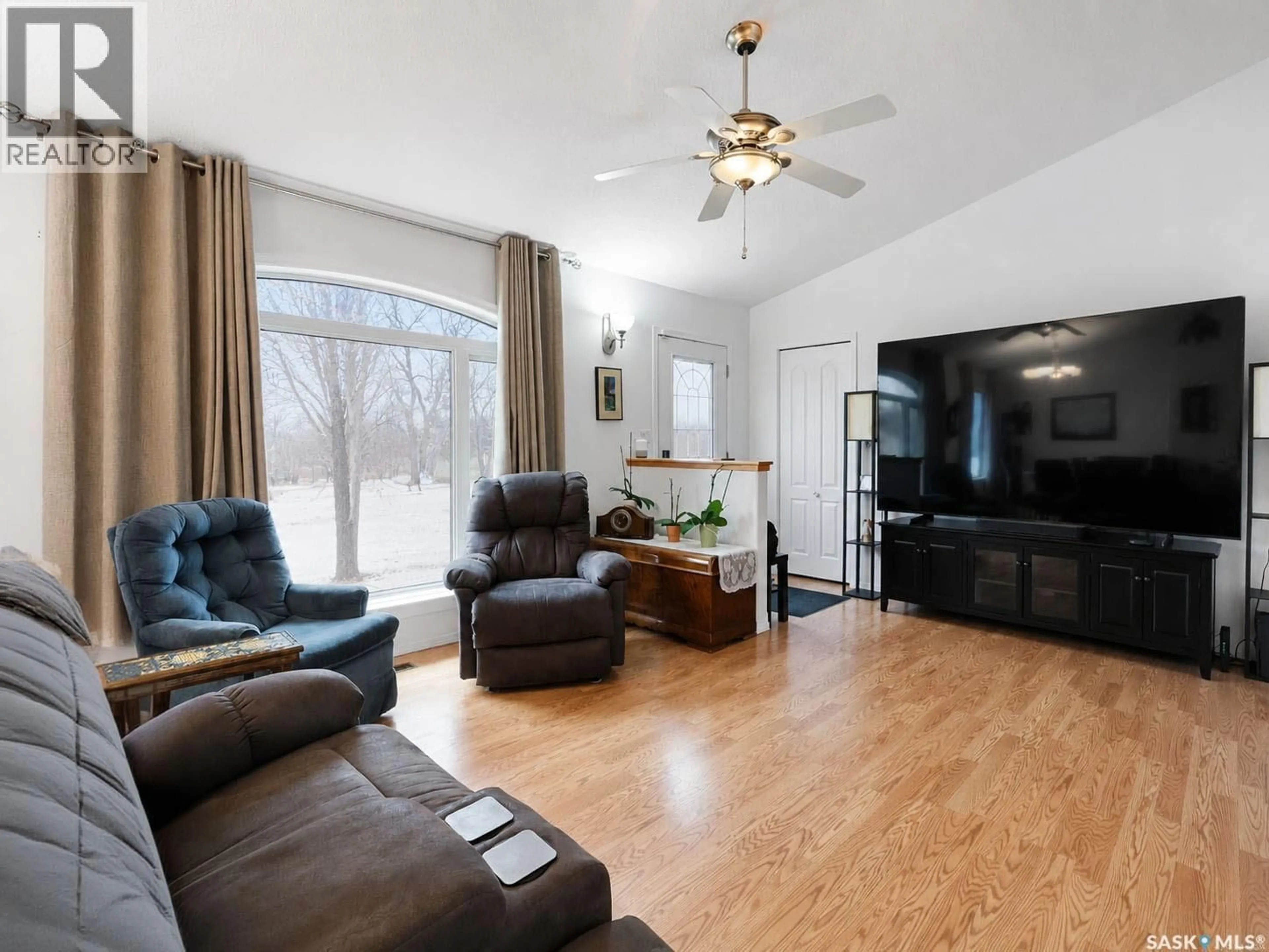 Living room with furniture, wood/laminate floor for 741 MAIN STREET, Canwood Saskatchewan S0J0B4