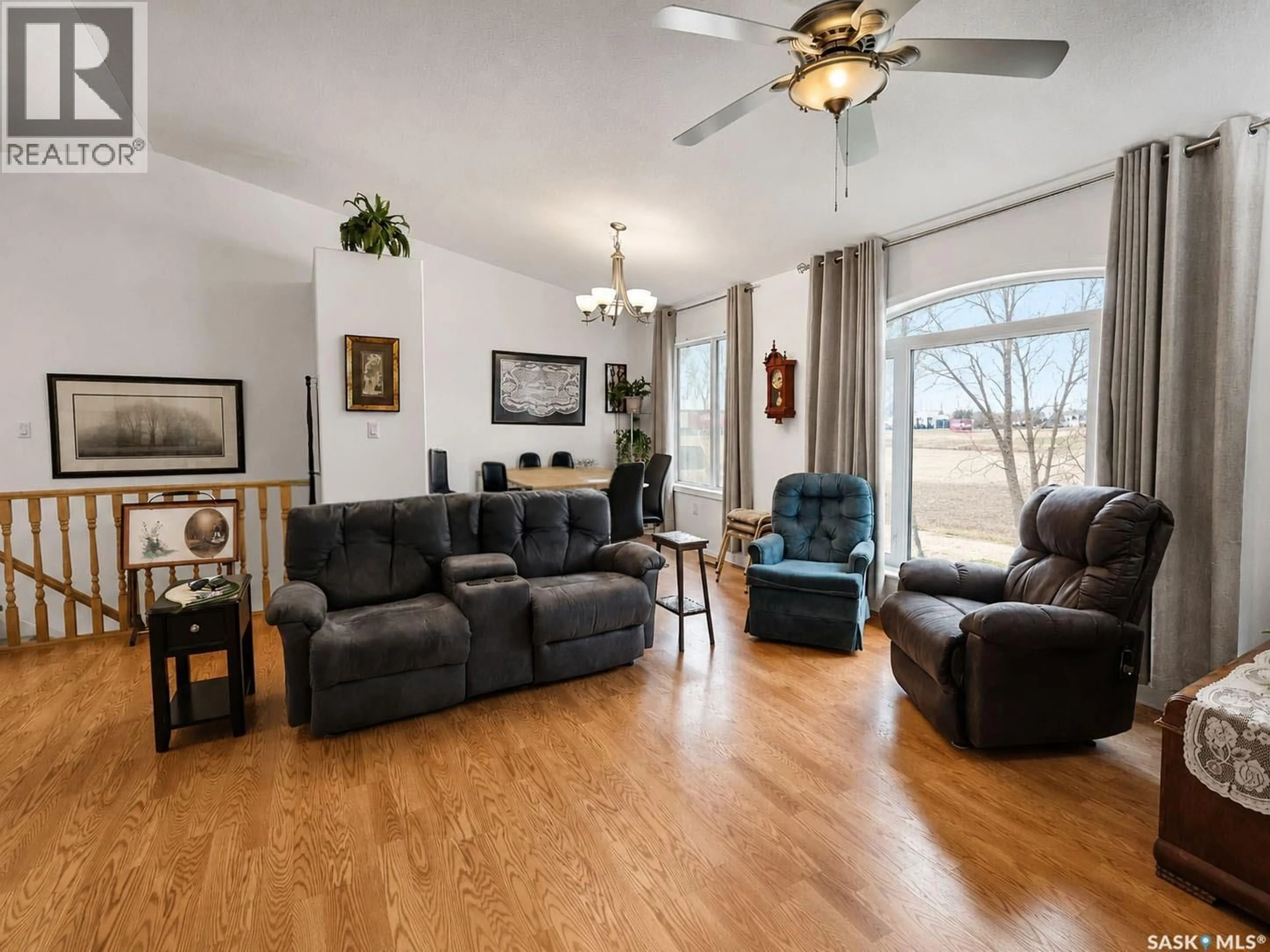 Living room with furniture, wood/laminate floor for 741 MAIN STREET, Canwood Saskatchewan S0J0B4