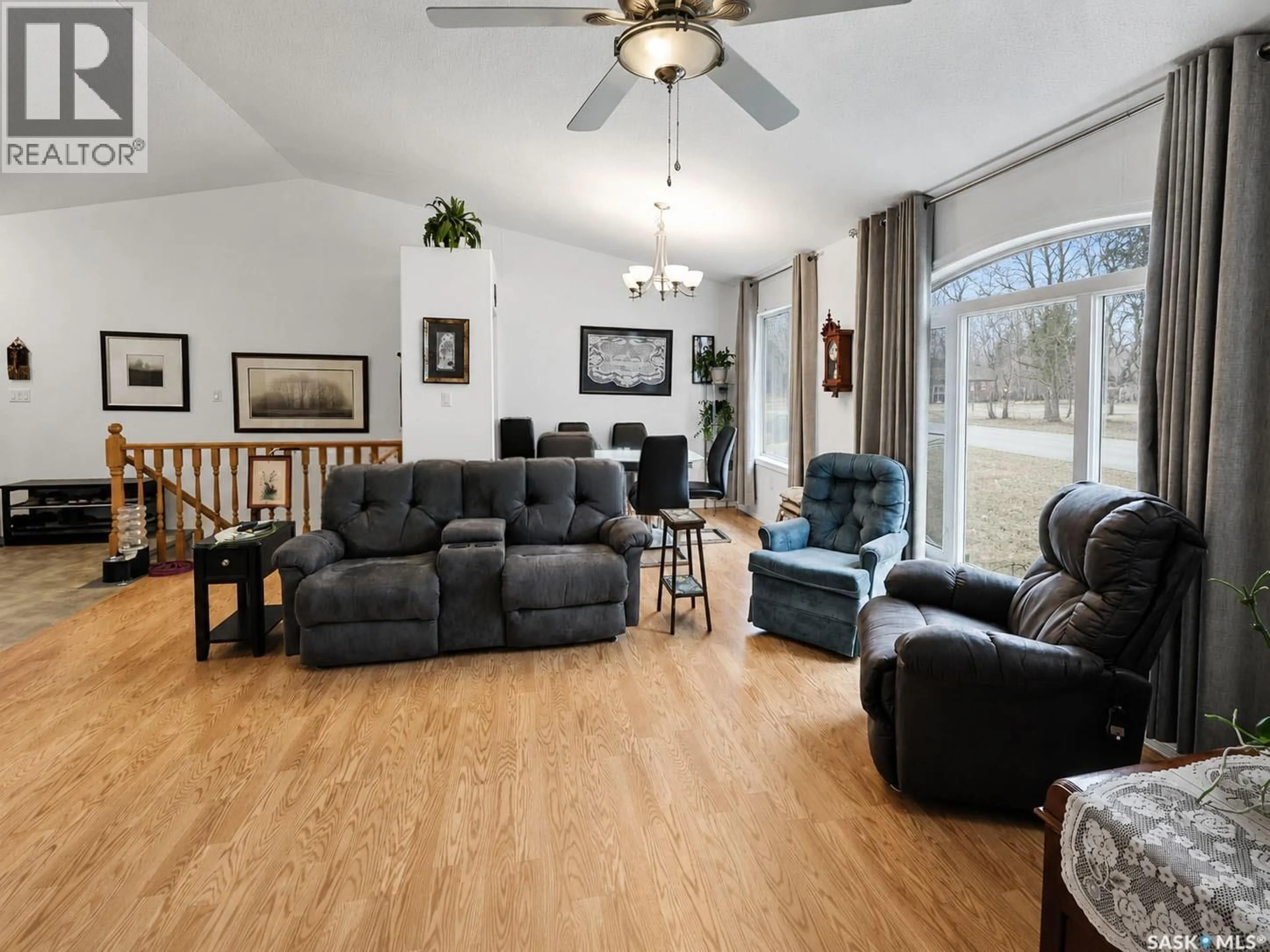 Living room with furniture, wood/laminate floor for 741 MAIN STREET, Canwood Saskatchewan S0J0B4