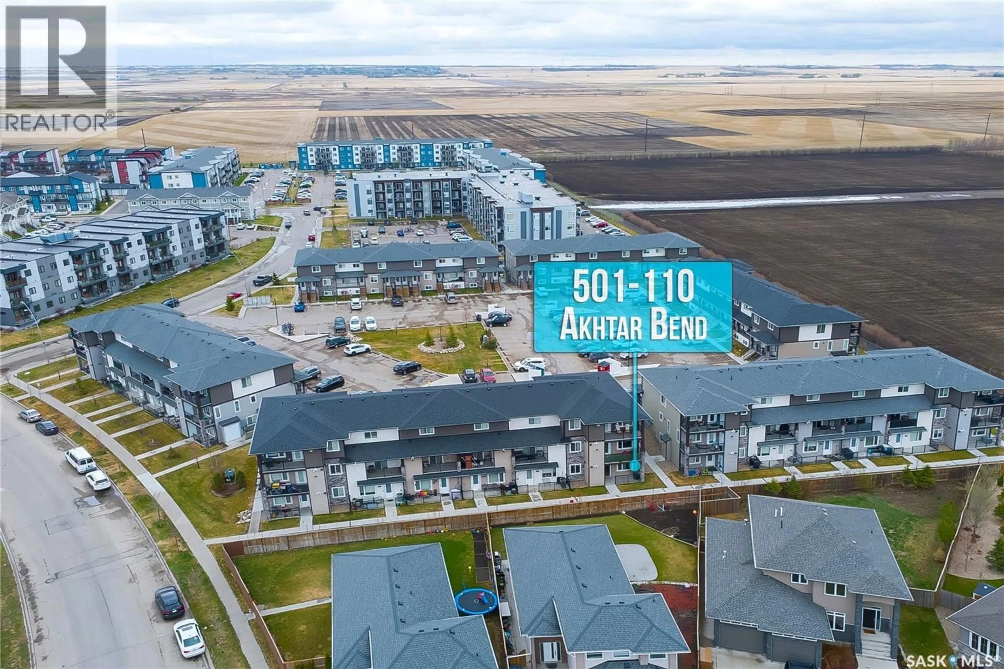 A pic from outside/outdoor area/front of a property/back of a property/a pic from drone, water/lake/river/ocean view for 501 110 AKHTAR BEND, Saskatoon Saskatchewan S7W0Y9