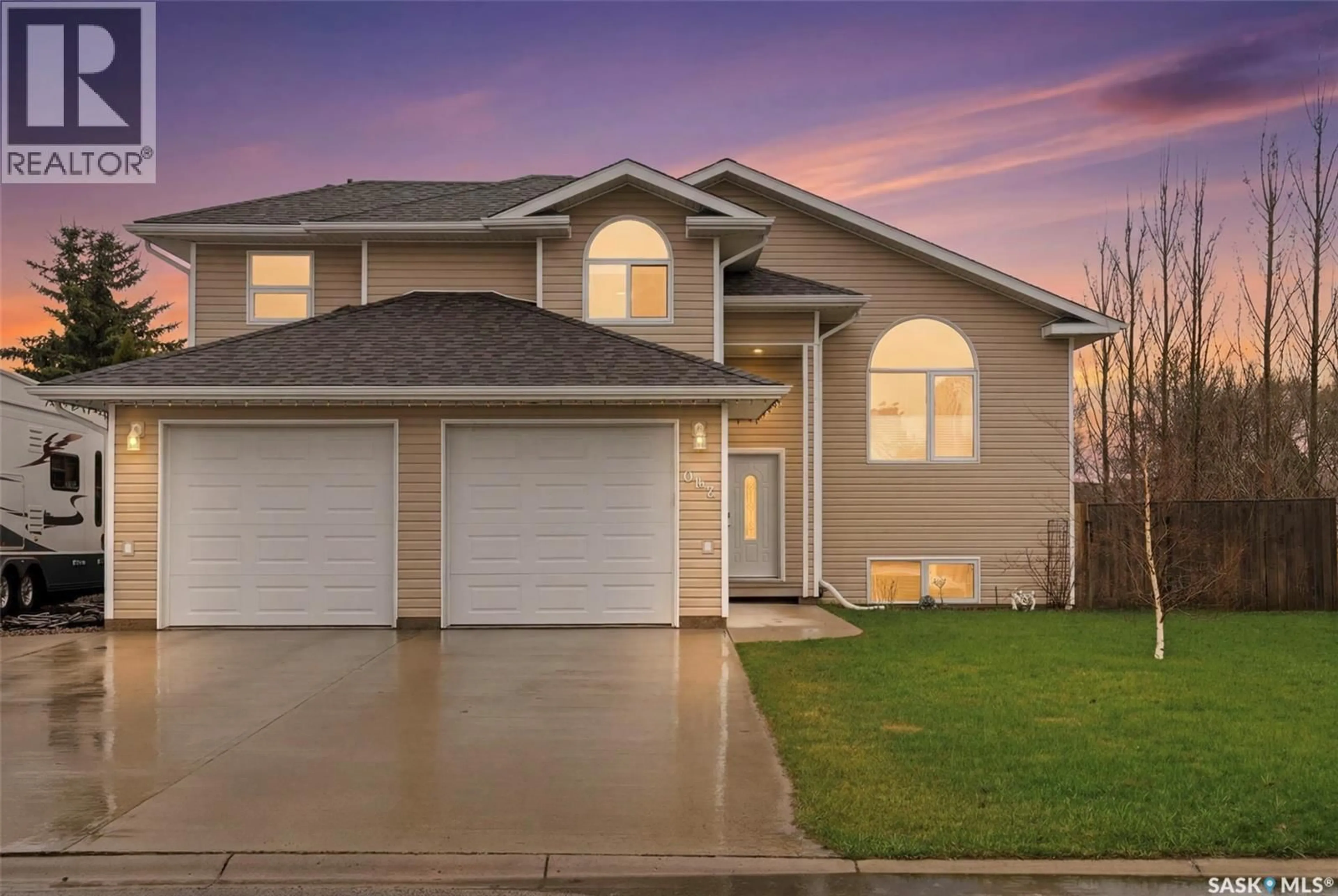 Home with vinyl exterior material, street for 1 WESTBY PLACE, Watrous Saskatchewan S0K4T0
