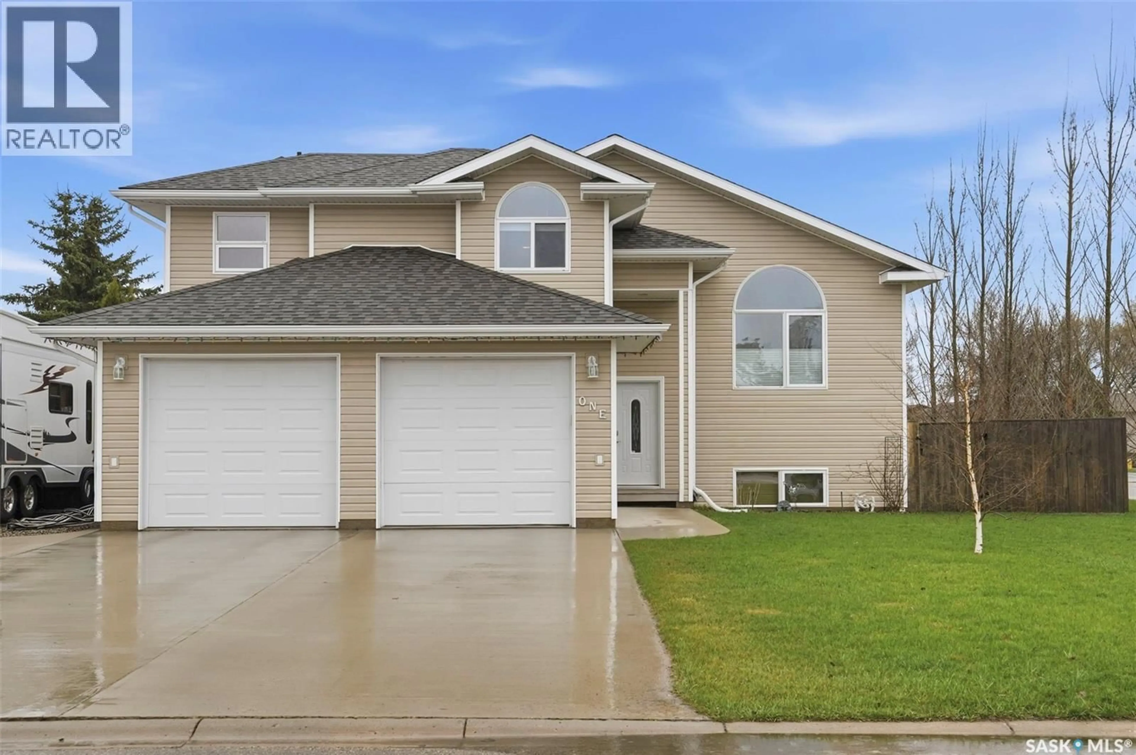 Home with vinyl exterior material, street for 1 WESTBY PLACE, Watrous Saskatchewan S0K4T0