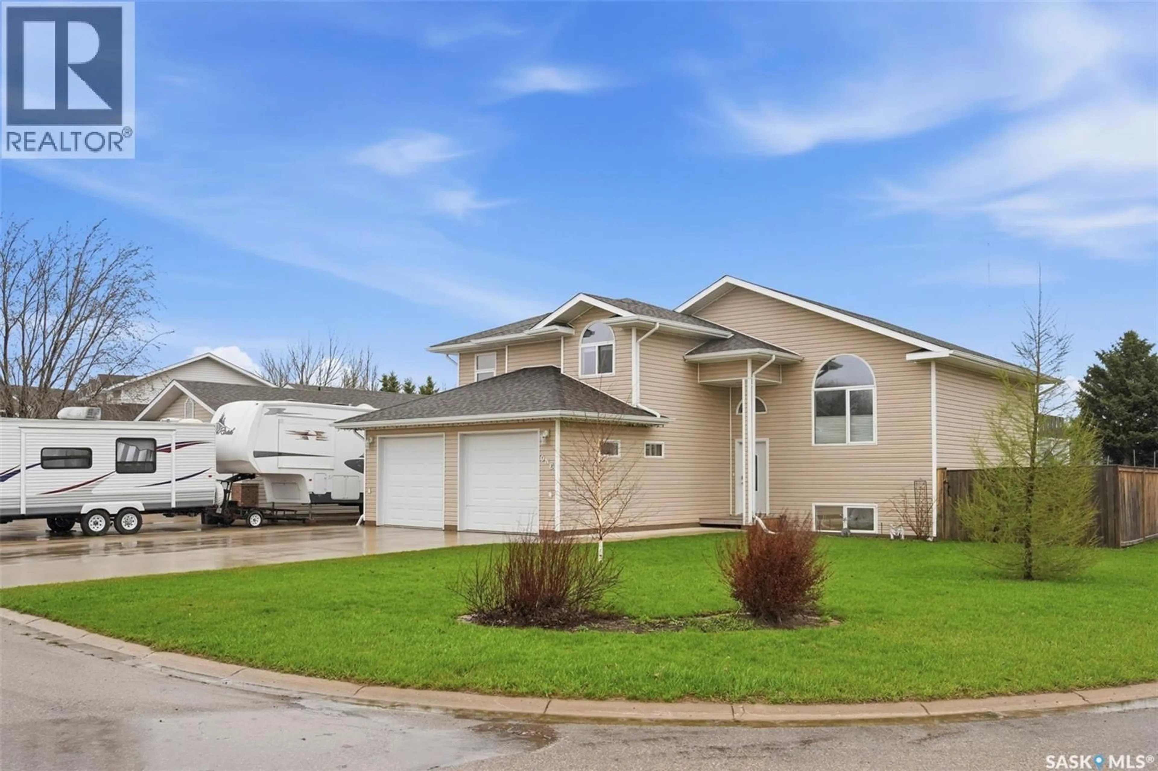 Home with vinyl exterior material, street for 1 WESTBY PLACE, Watrous Saskatchewan S0K4T0