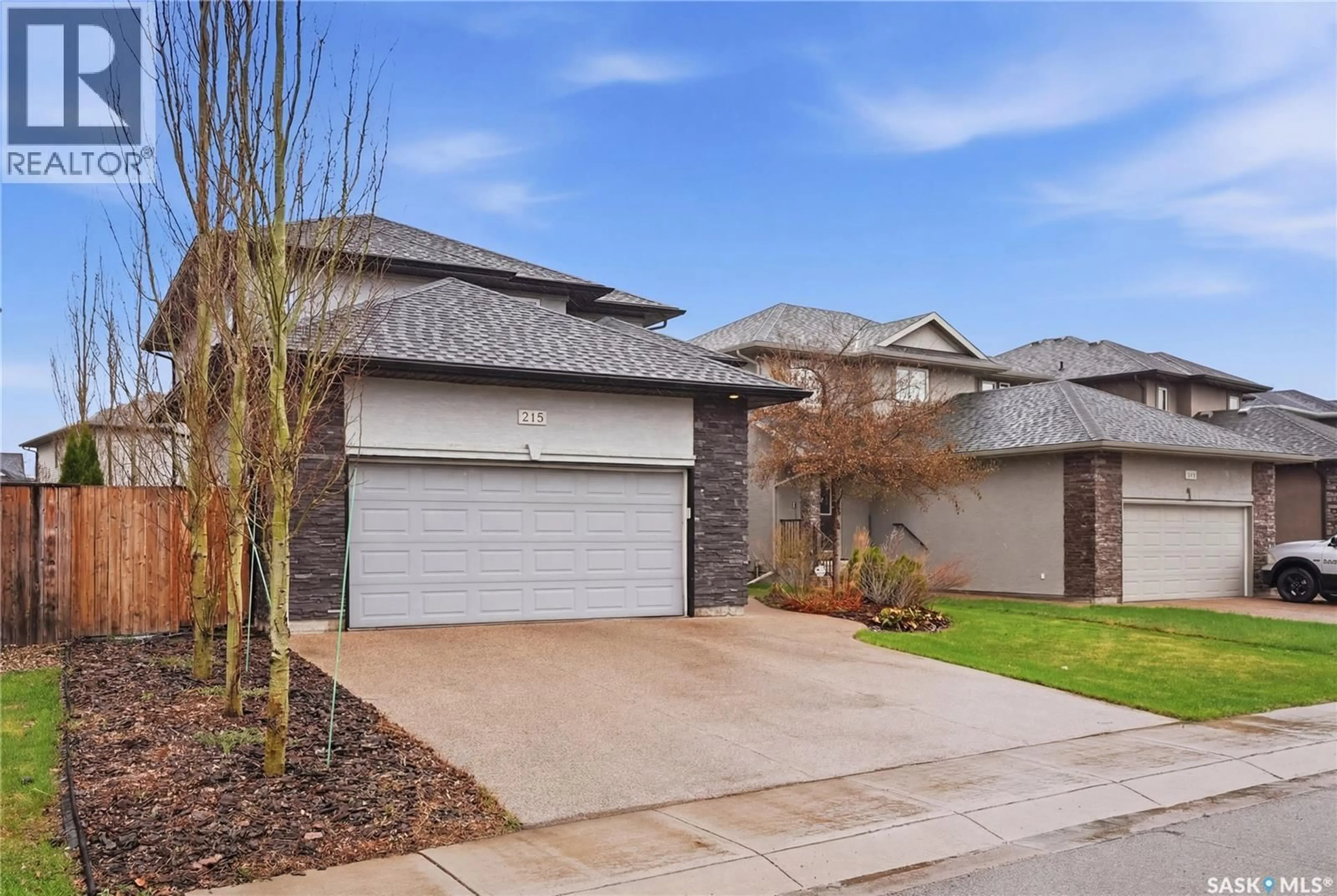 Home with brick exterior material, street for 215 WHALLEY CRESCENT, Saskatoon Saskatchewan S7T0E6