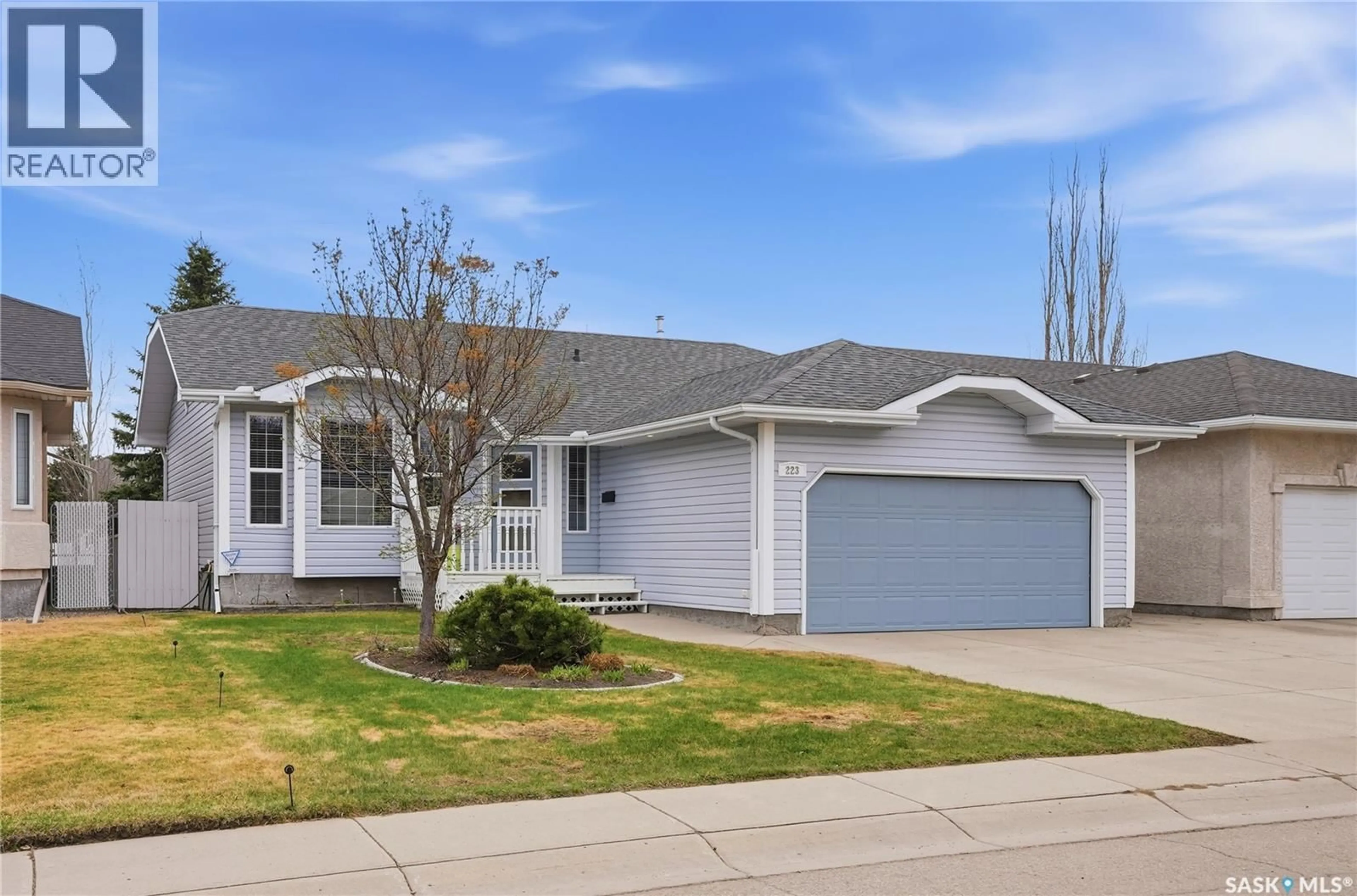 Home with vinyl exterior material, street for 223 POBRAN LANE, Saskatoon Saskatchewan S7S1L5
