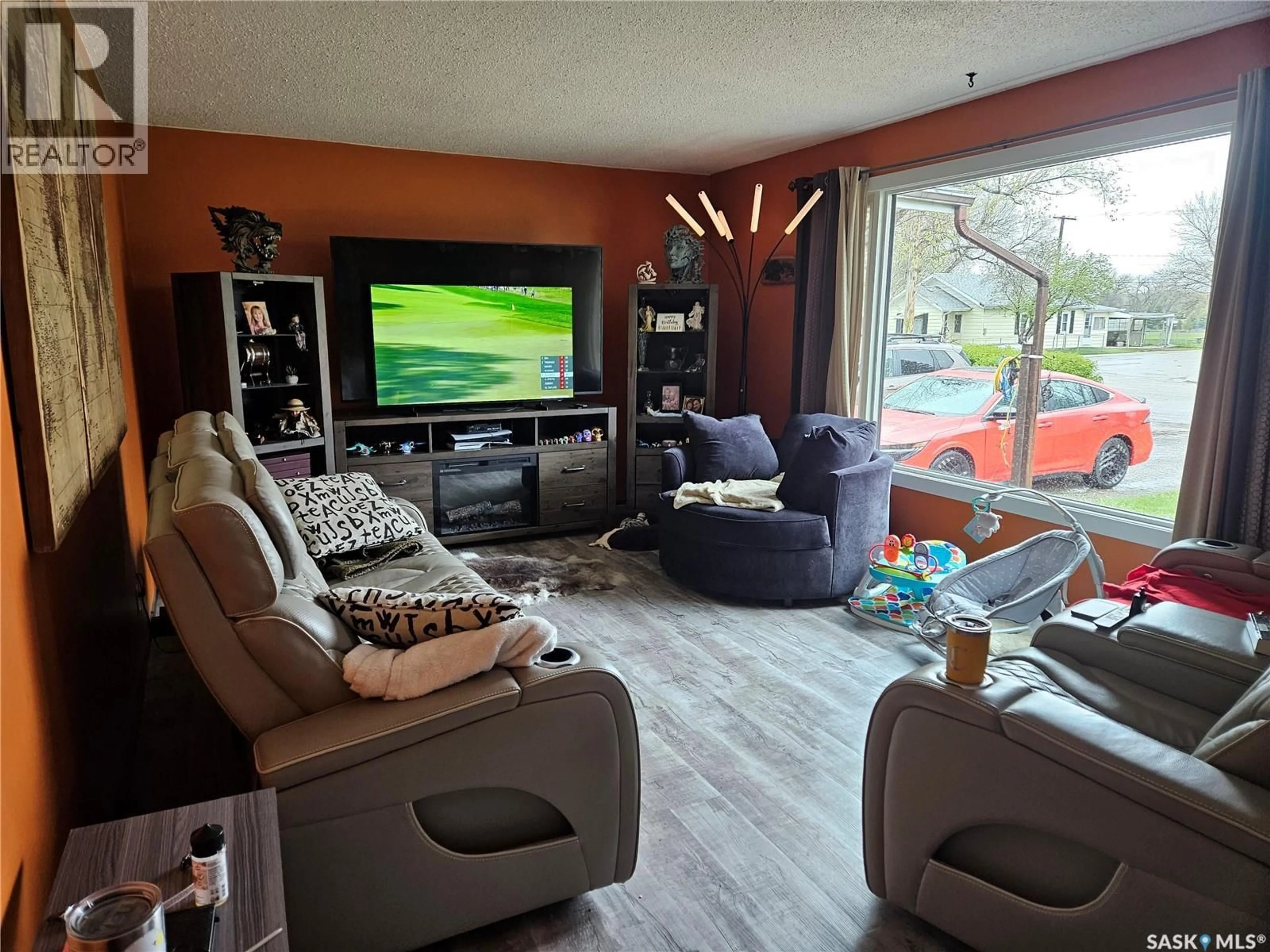Living room with furniture, wood/laminate floor for 1204 NORTH RAILWAY STREET, Swift Current Saskatchewan S9H1E7