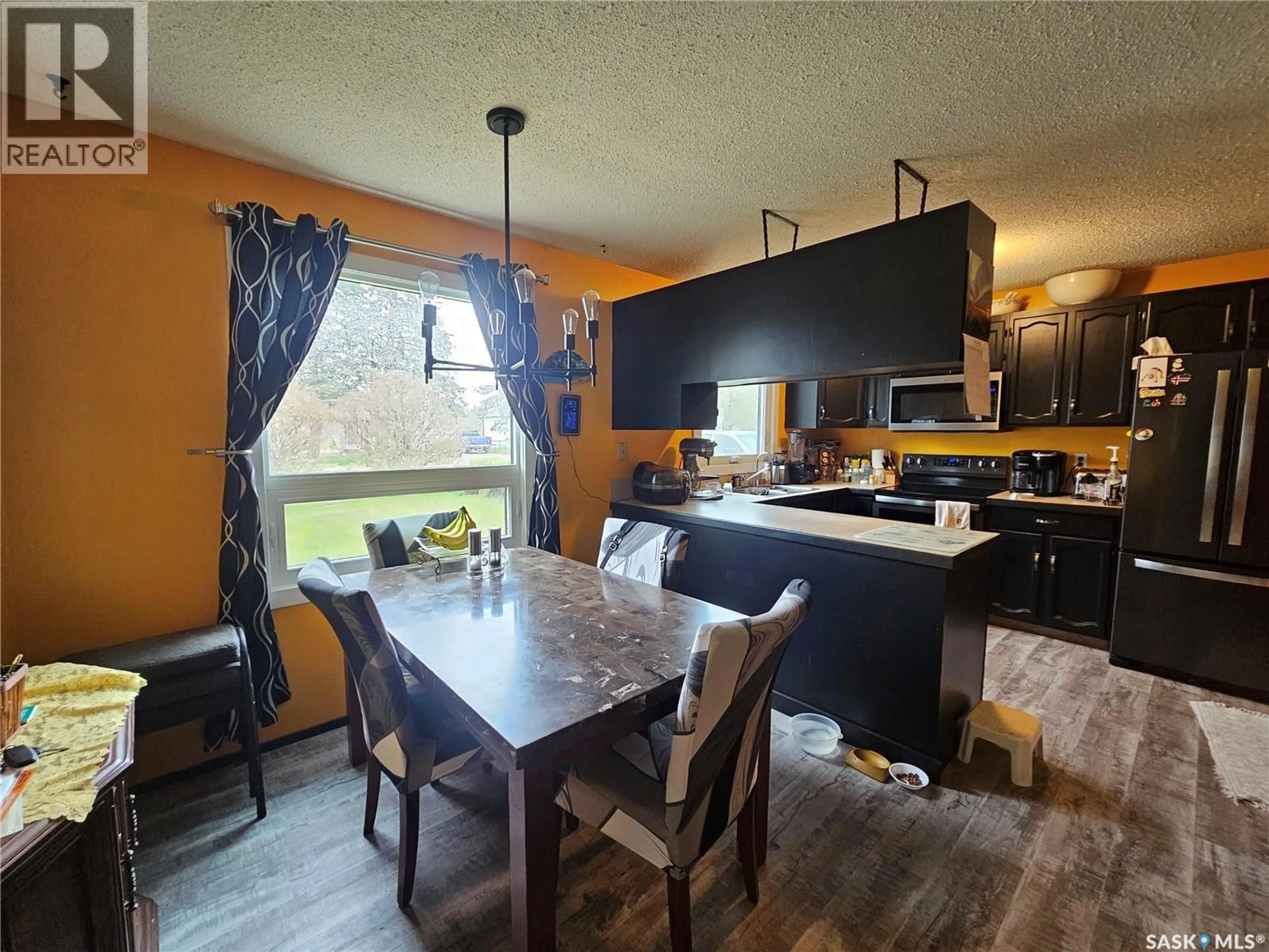 Open concept kitchen, wood/laminate floor for 1204 NORTH RAILWAY STREET, Swift Current Saskatchewan S9H1E7