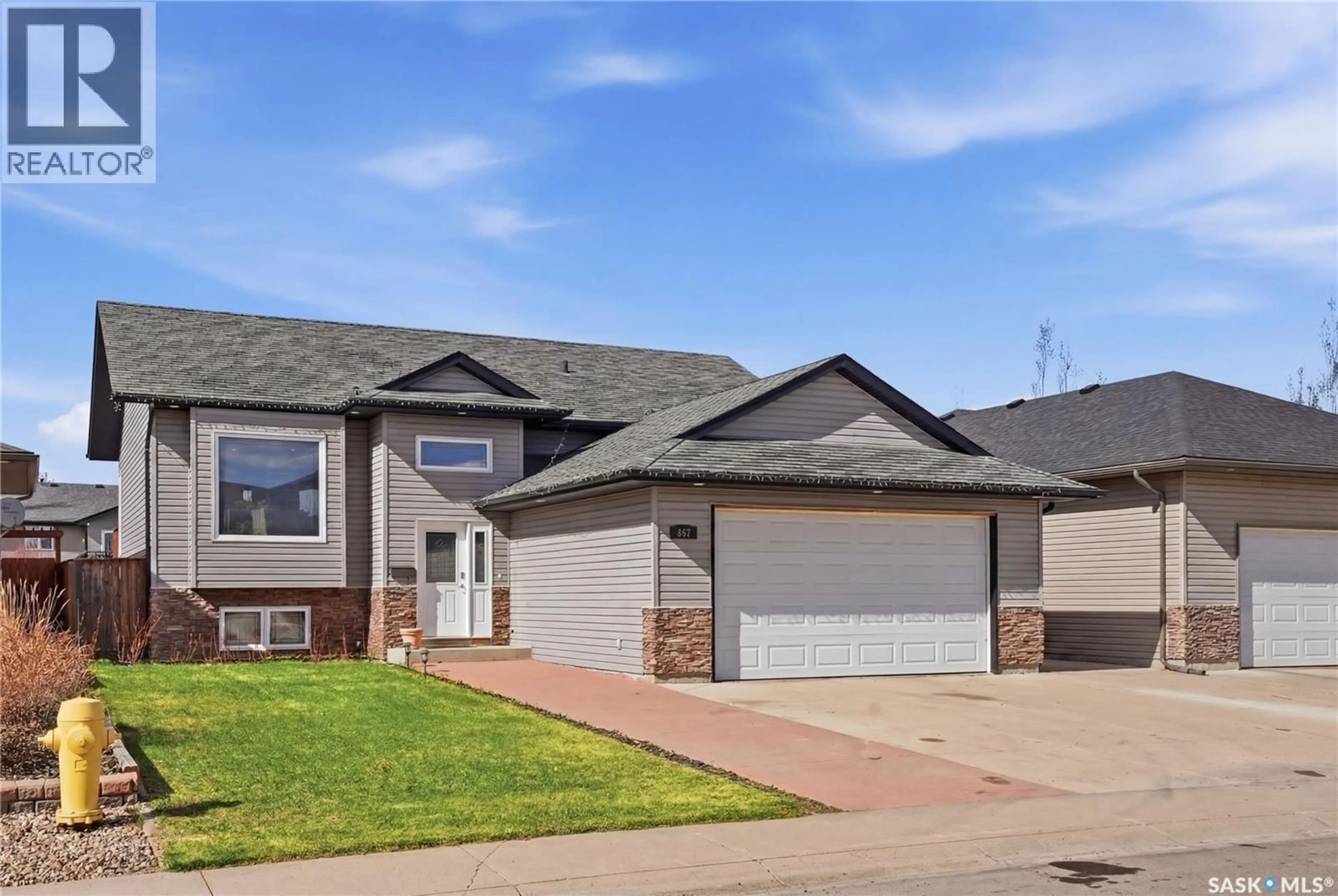 Home with brick exterior material, street for 817 COLUMBIA WAY, Martensville Saskatchewan S0K0A2