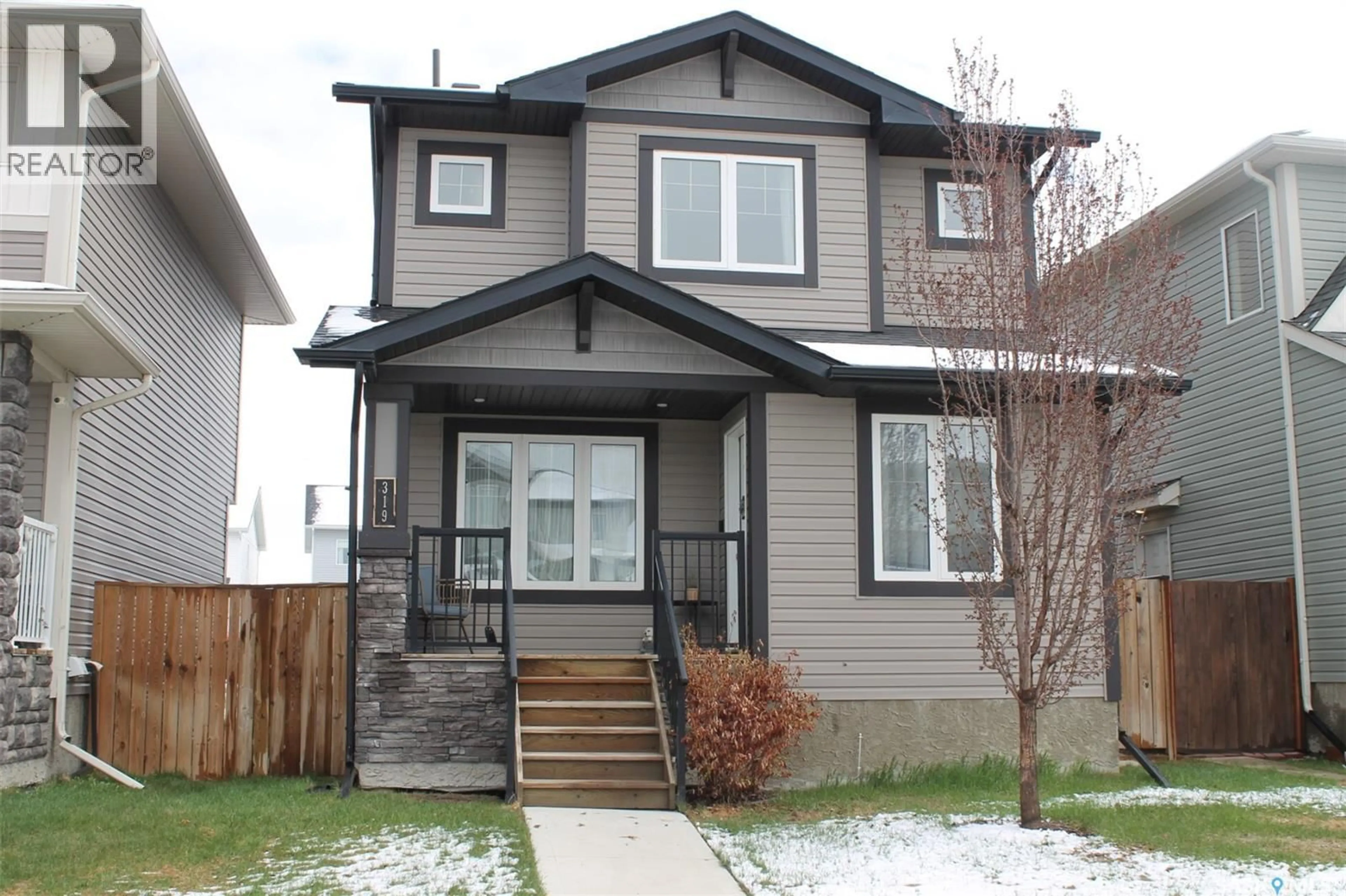 Home with vinyl exterior material, street for 319 SECORD WAY, Saskatoon Saskatchewan S7V0L9
