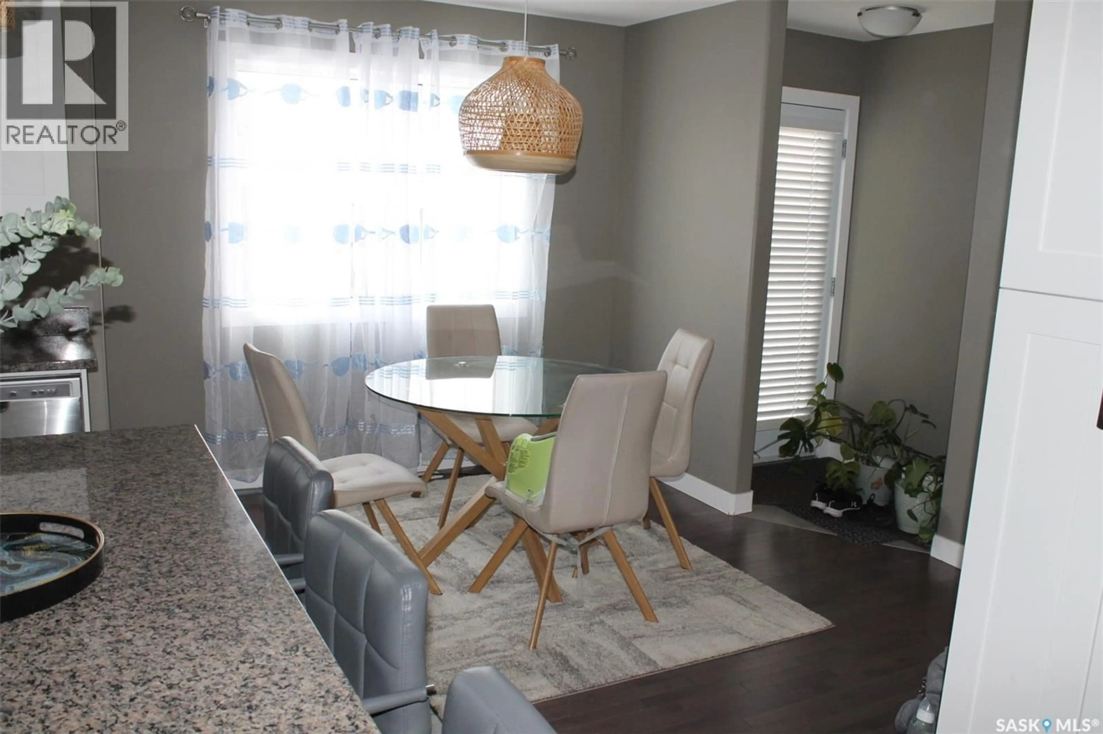 Dining room, wood/laminate floor for 319 SECORD WAY, Saskatoon Saskatchewan S7V0L9