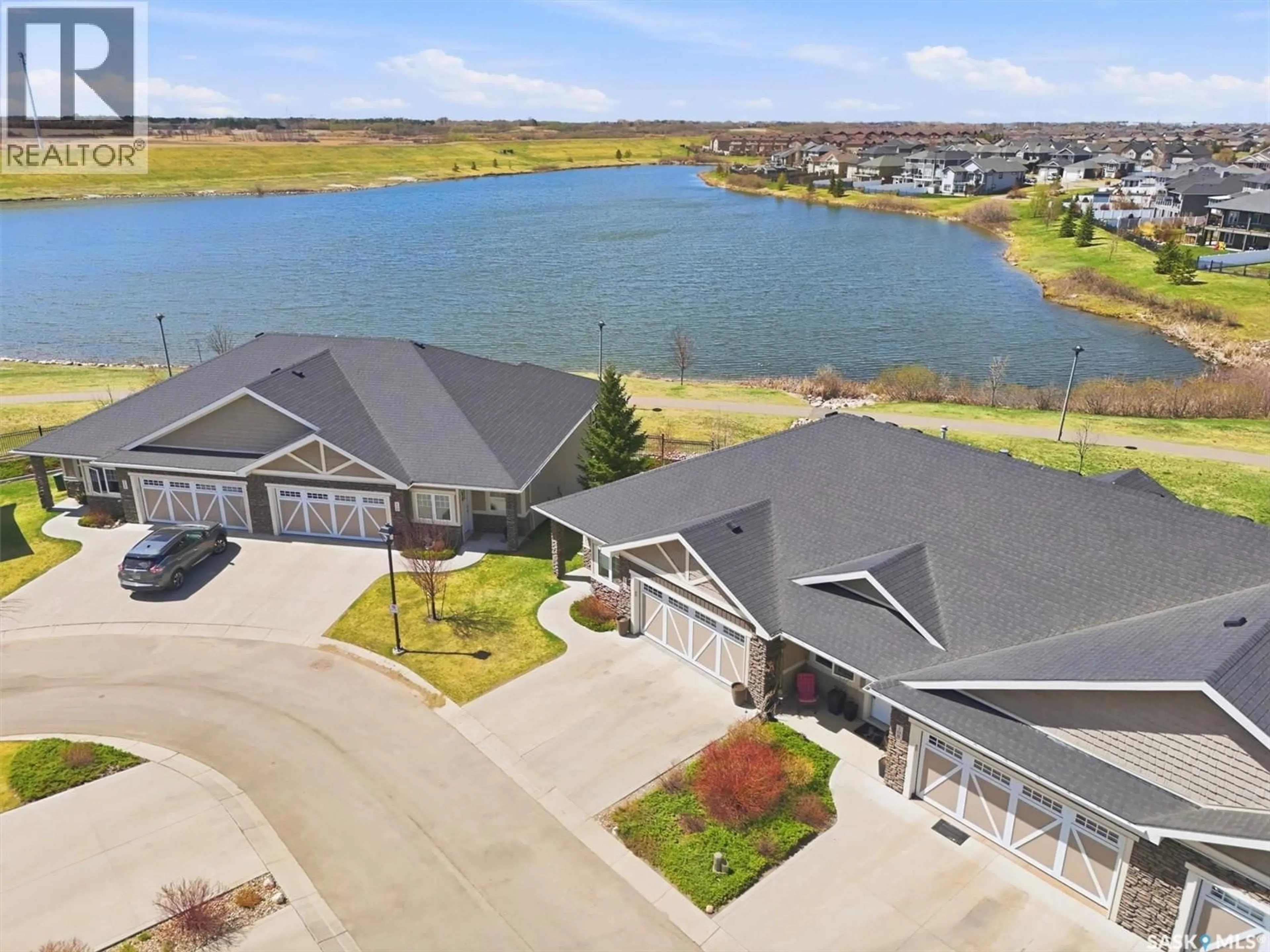 A pic from outside/outdoor area/front of a property/back of a property/a pic from drone, water/lake/river/ocean view for 109 542 PRINGLE CRESCENT, Saskatoon Saskatchewan S7T0W9