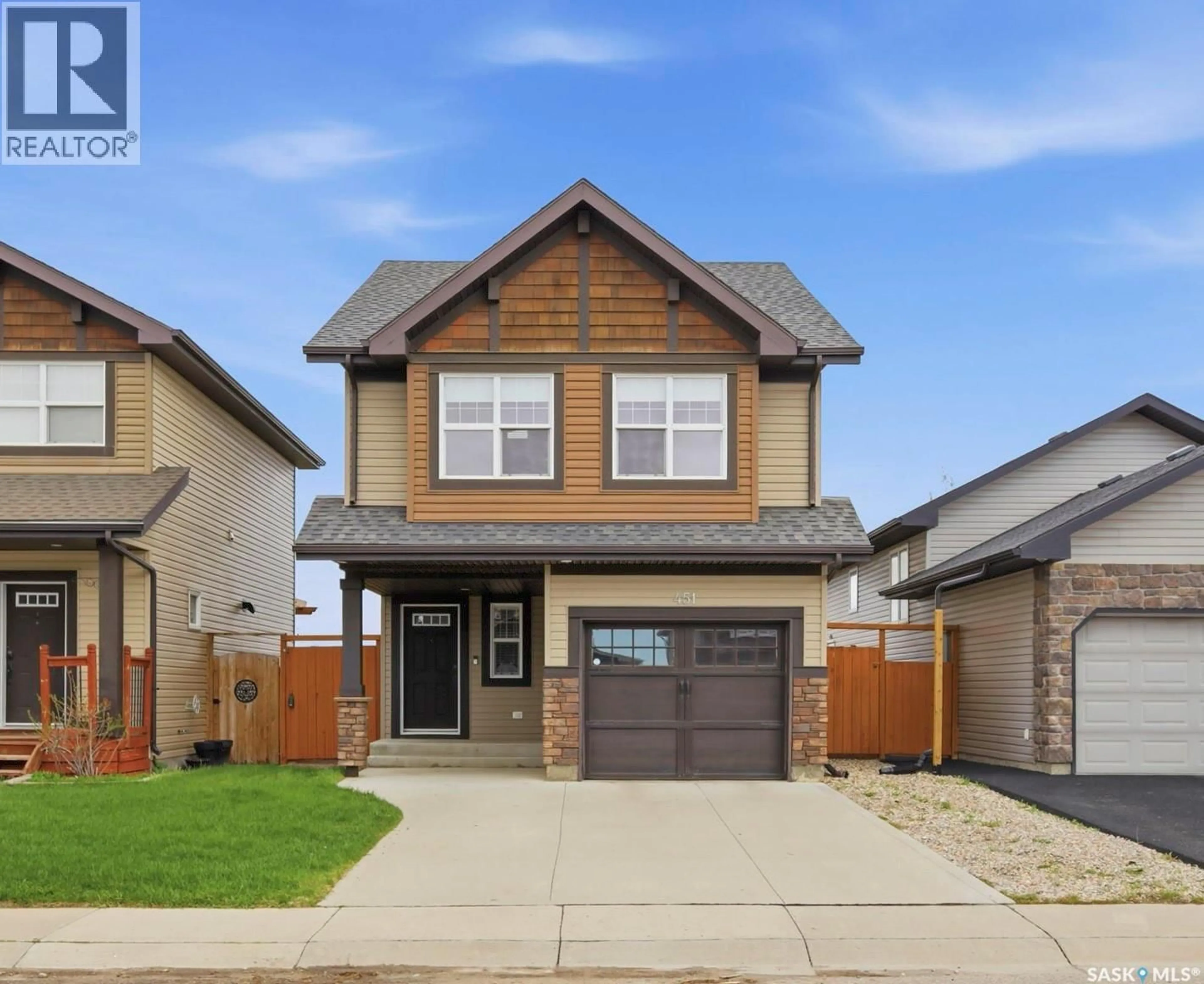 Home with vinyl exterior material, street for 451 HENICK CRESCENT, Saskatoon Saskatchewan S7R0J4