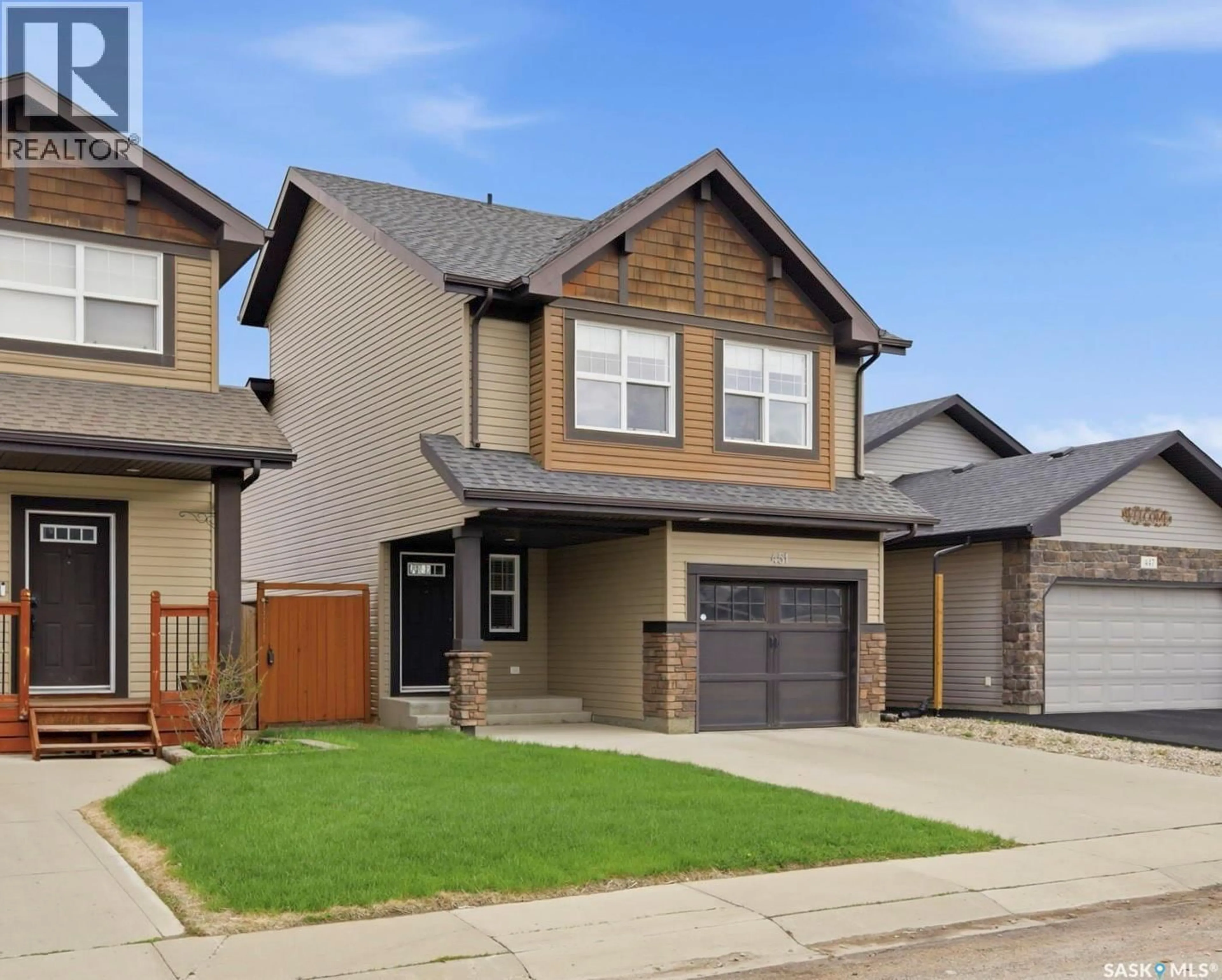 Home with vinyl exterior material, street for 451 HENICK CRESCENT, Saskatoon Saskatchewan S7R0J4