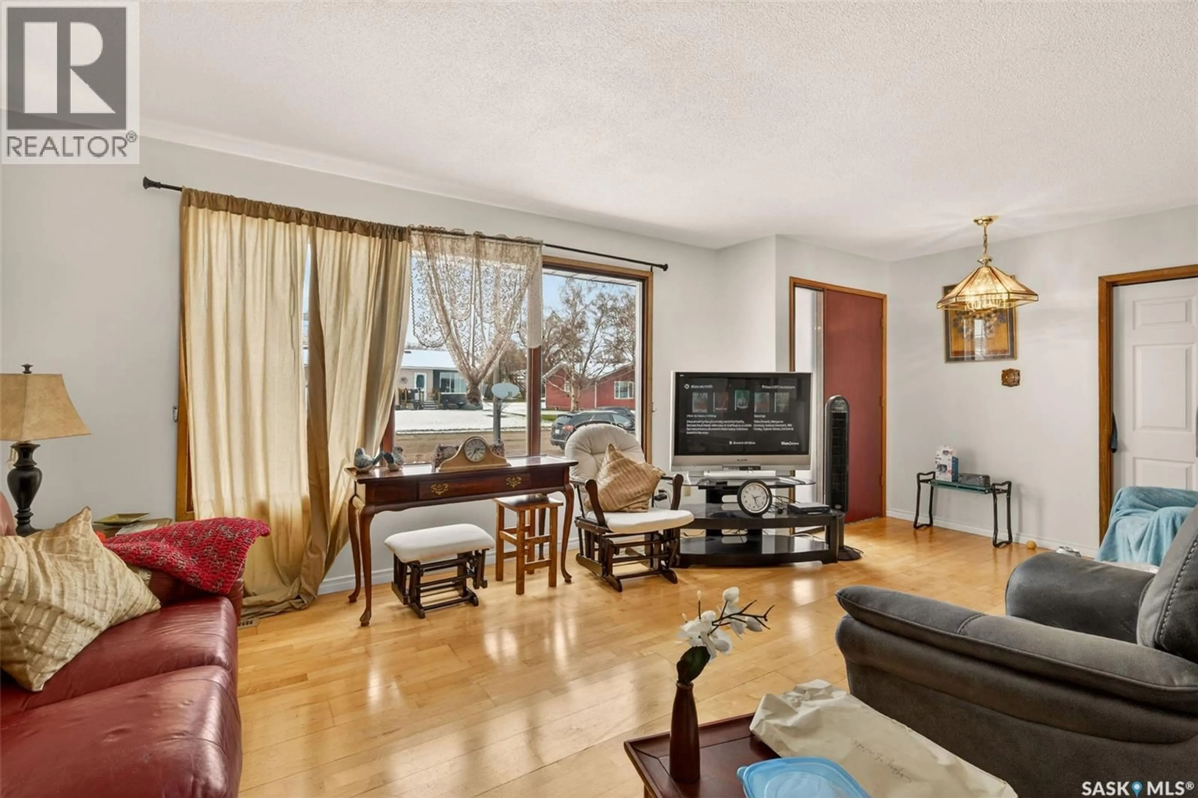 Living room with furniture, wood/laminate floor for 306 4TH STREET, Naicam Saskatchewan S0K2Z0