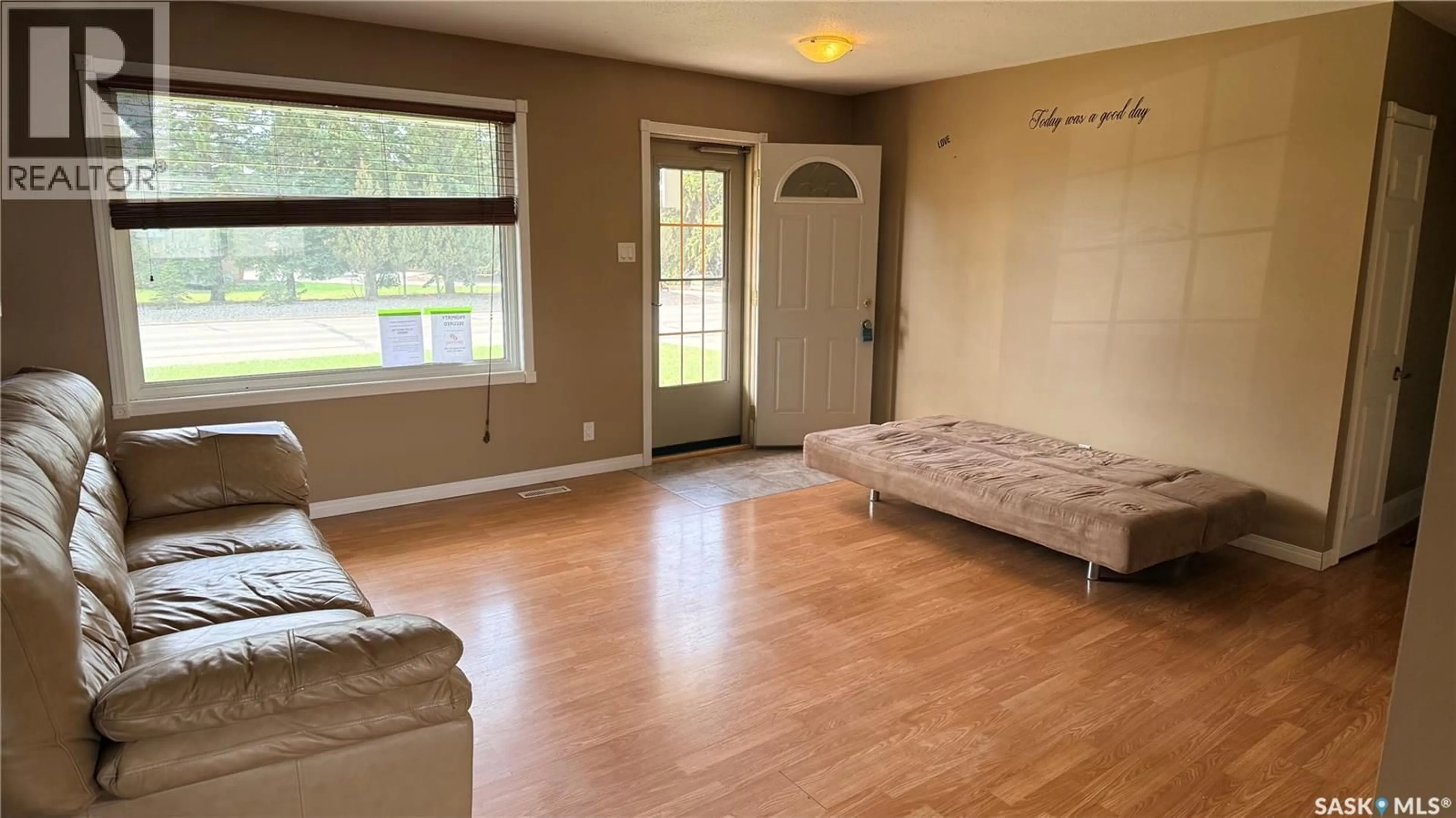 Living room with furniture, wood/laminate floor for 1276 KING STREET, Estevan Saskatchewan S4A1L5