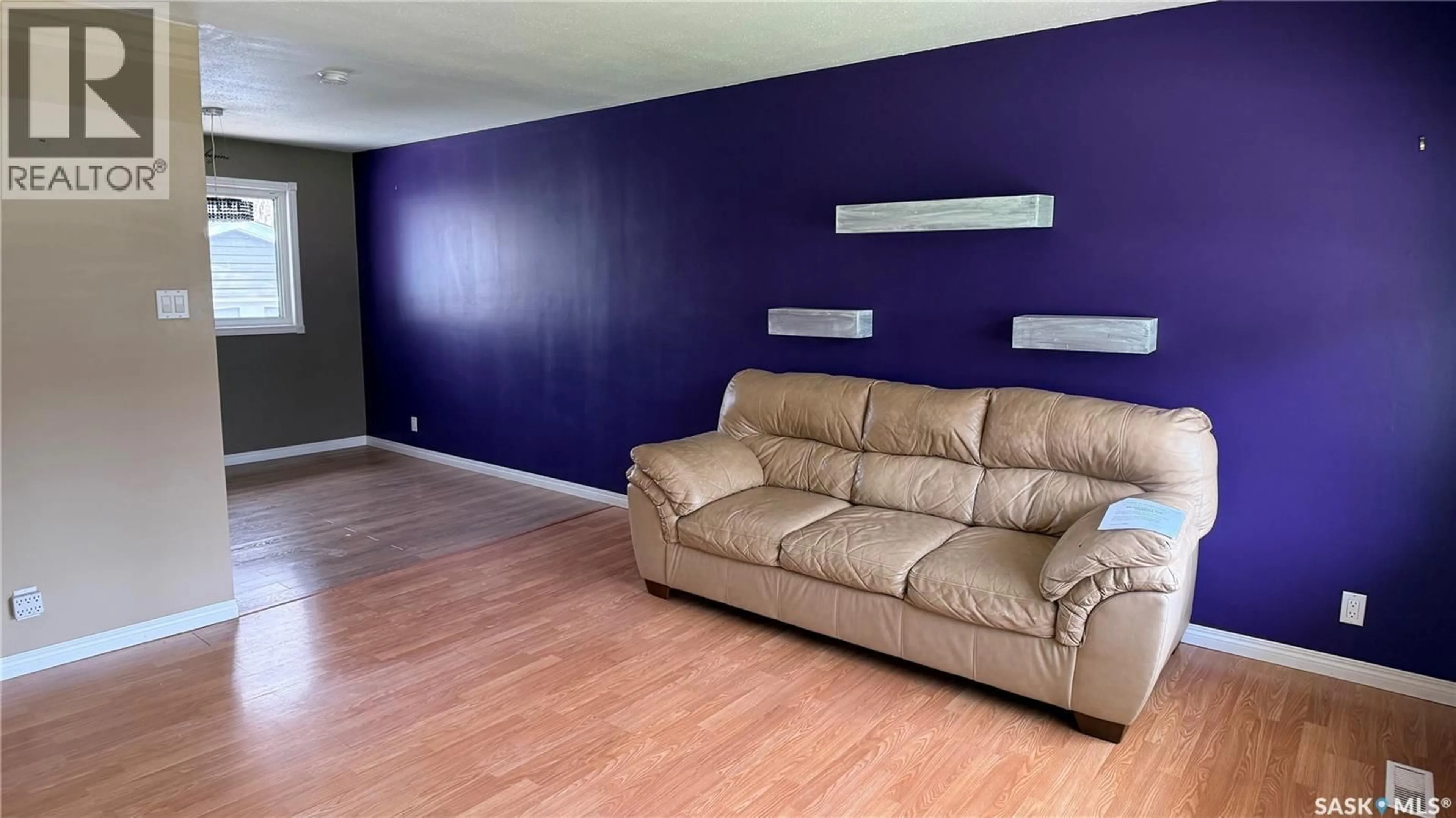 Living room with furniture, wood/laminate floor for 1276 KING STREET, Estevan Saskatchewan S4A1L5