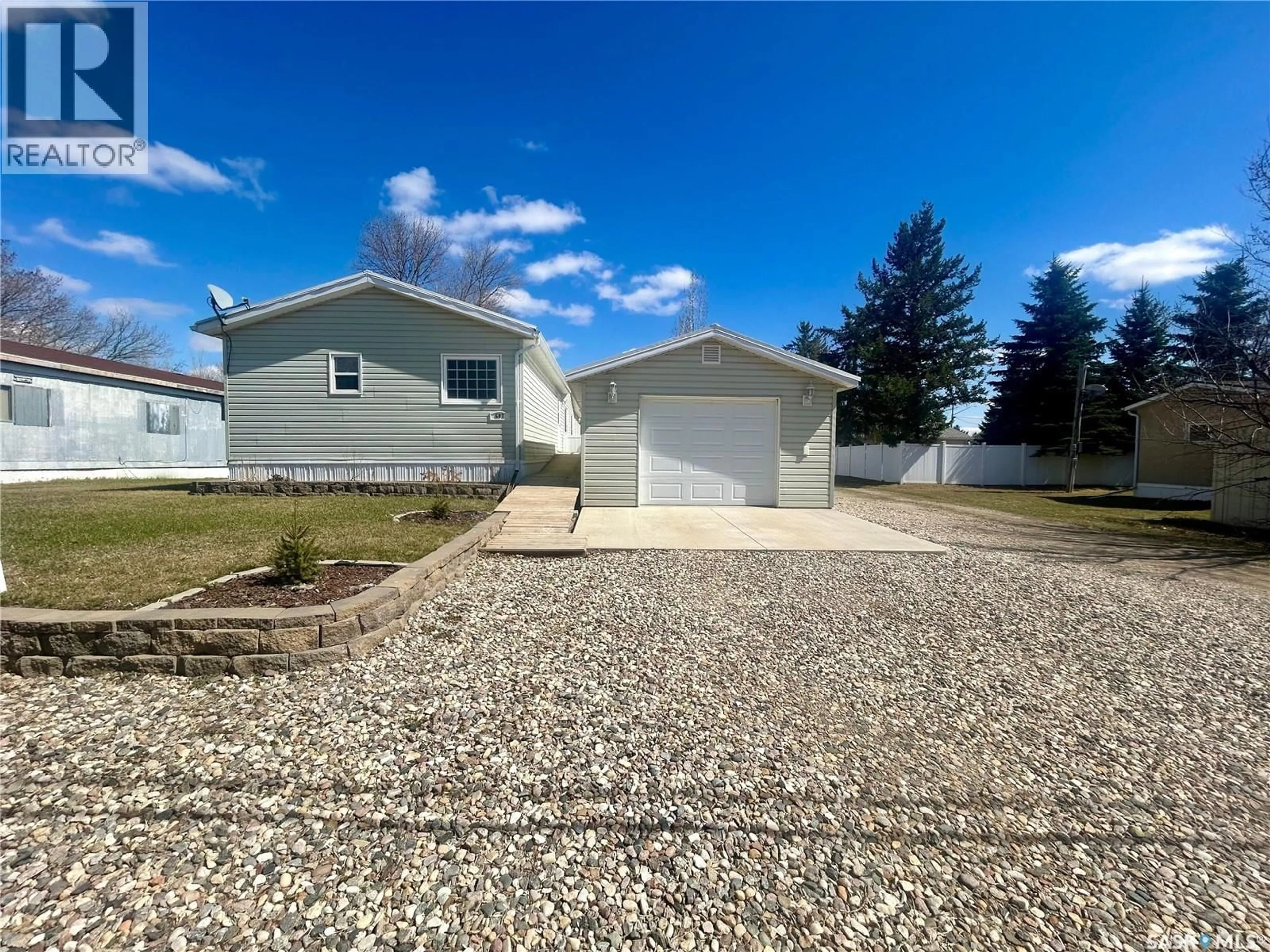 Home with vinyl exterior material, street for 607 BEHARREL STREET, Oxbow Saskatchewan S0C2B0