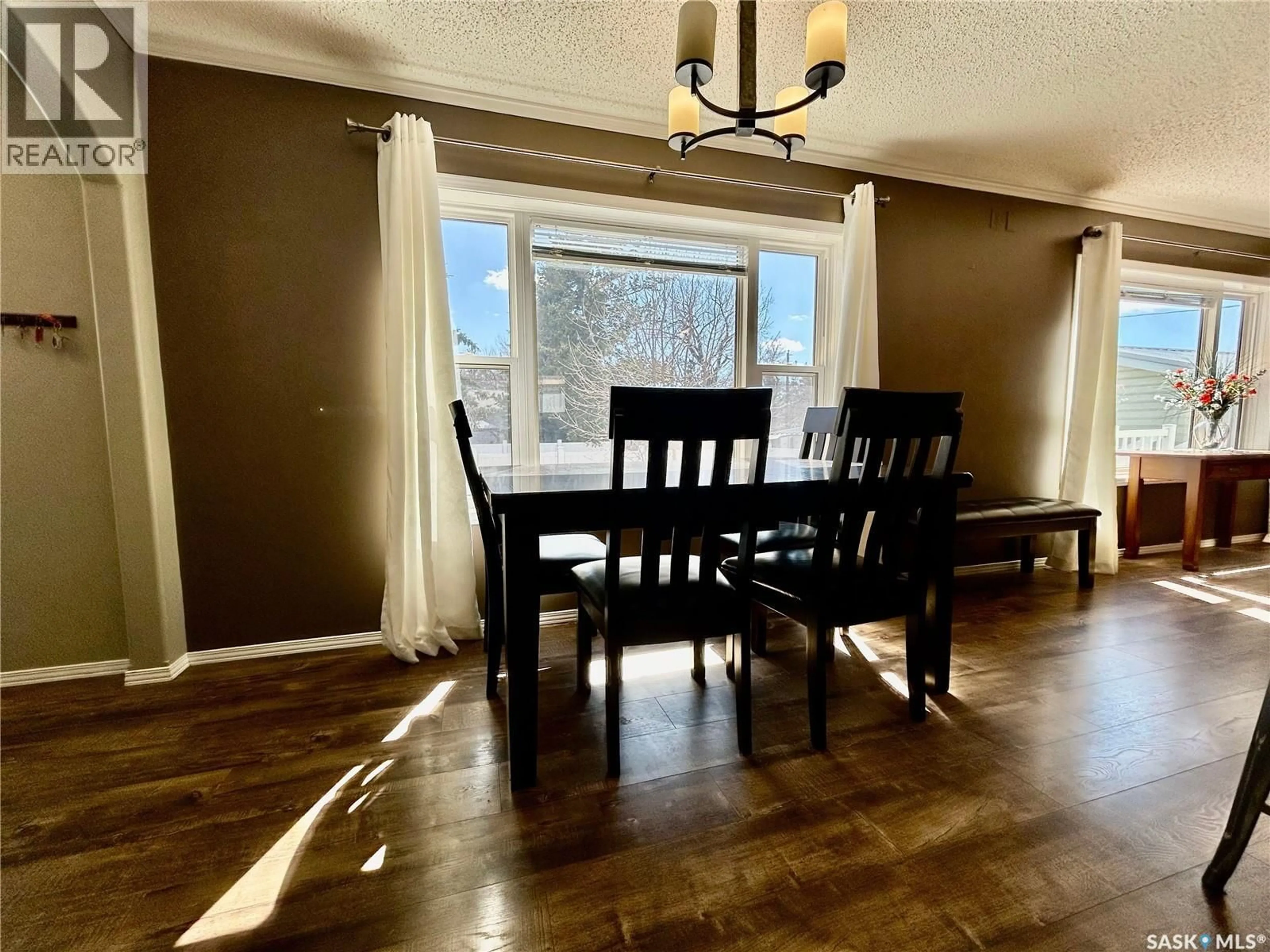 Dining room, wood/laminate floor for 607 BEHARREL STREET, Oxbow Saskatchewan S0C2B0
