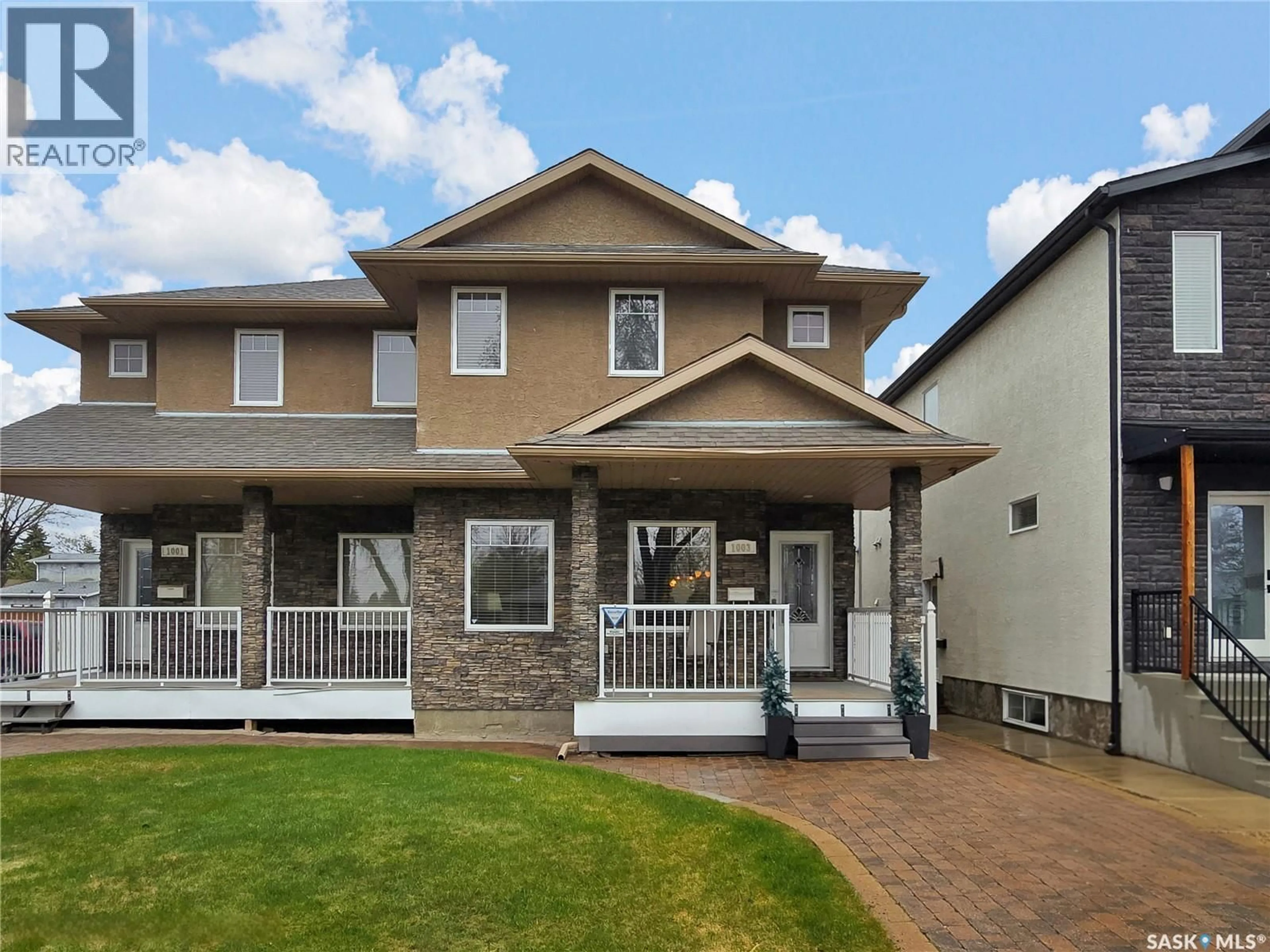 Home with vinyl exterior material, street for 1003 5TH STREET, Saskatoon Saskatchewan S7H1H3