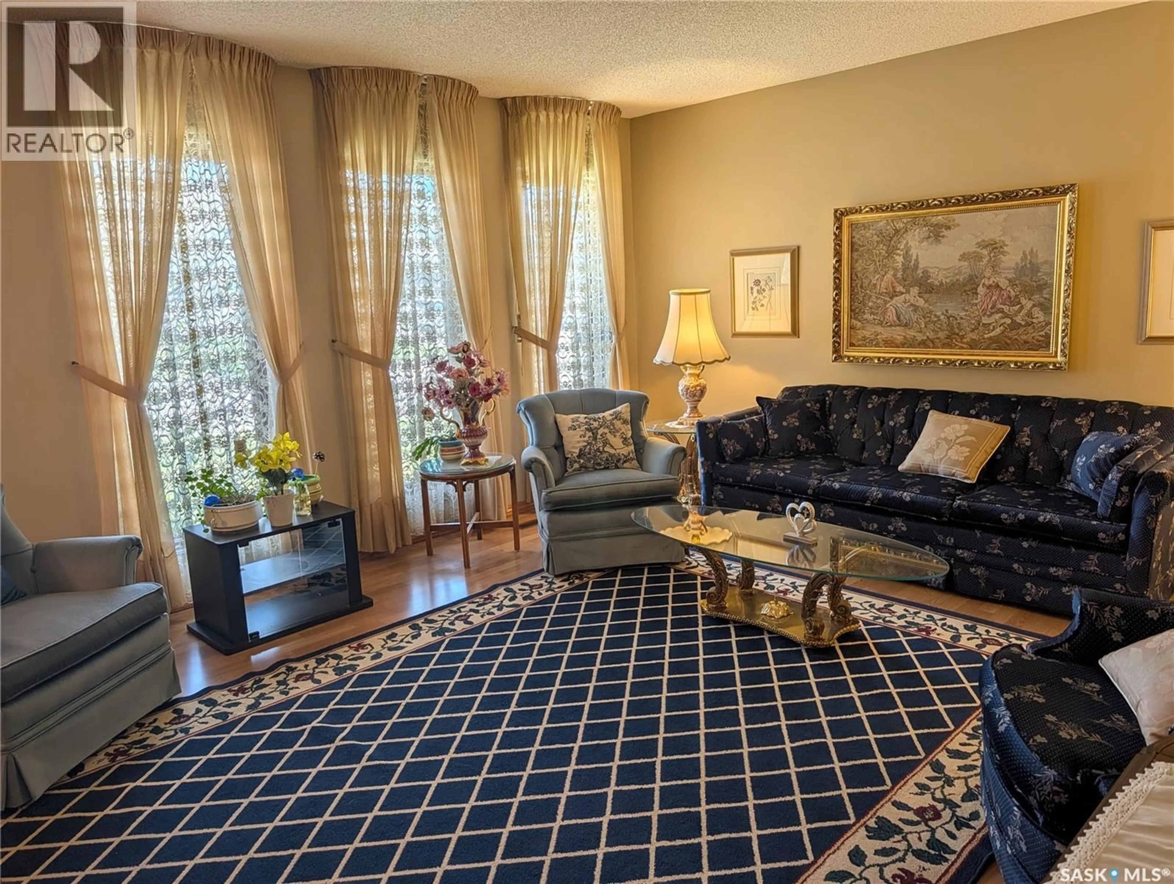 Living room with furniture, carpet floor for 215 DALGLIESH DRIVE, Regina Saskatchewan S4R7Z6