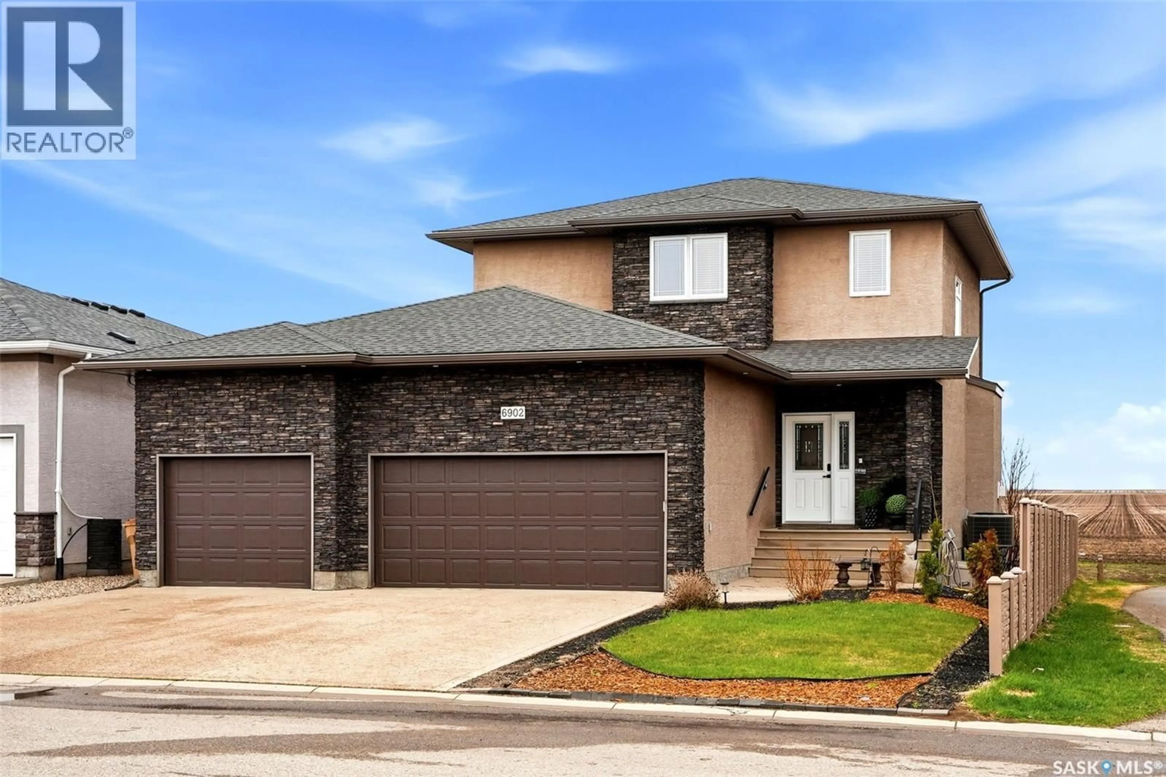 Home with brick exterior material, street for 6902 MAPLE VISTA DRIVE, Regina Saskatchewan S4X0J8
