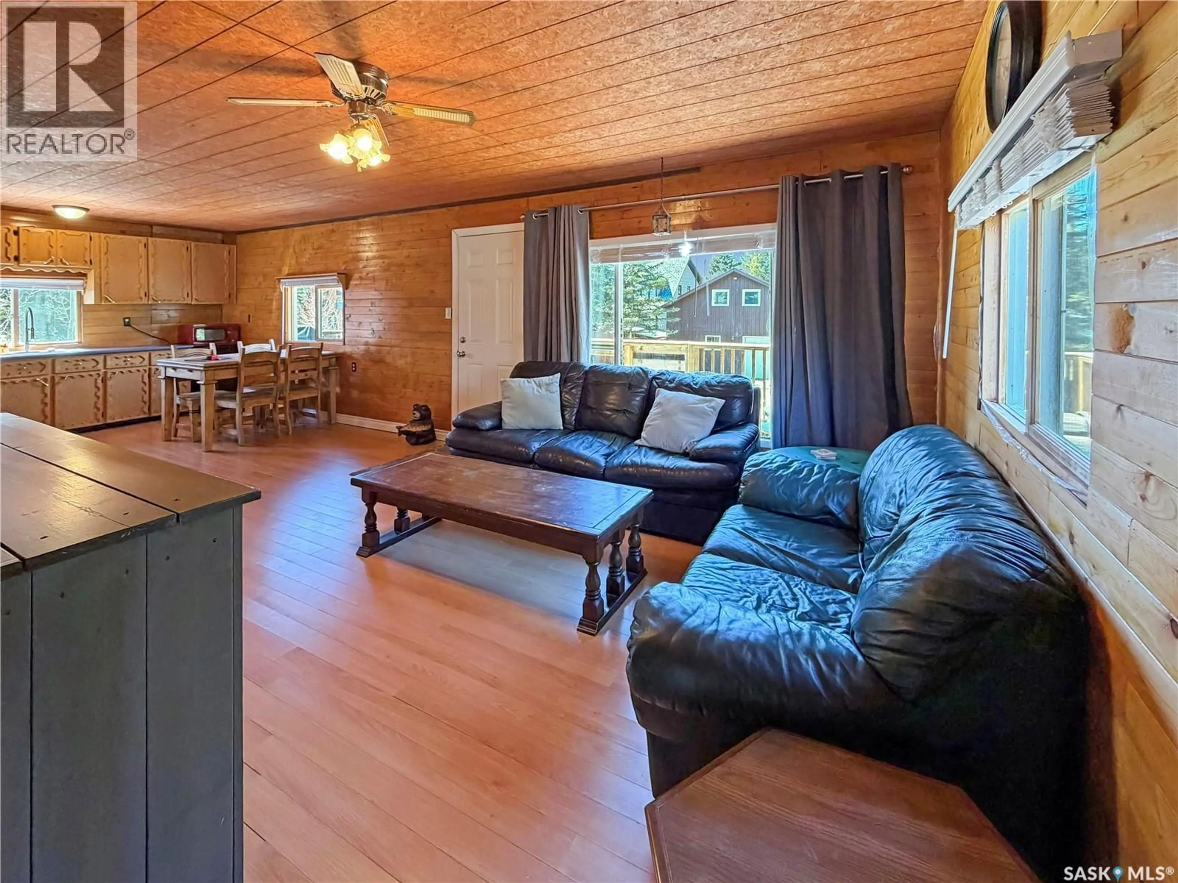 Living room with furniture, wood/laminate floor for 1 HANSON PLACE, Candle Lake Saskatchewan S0J3E0