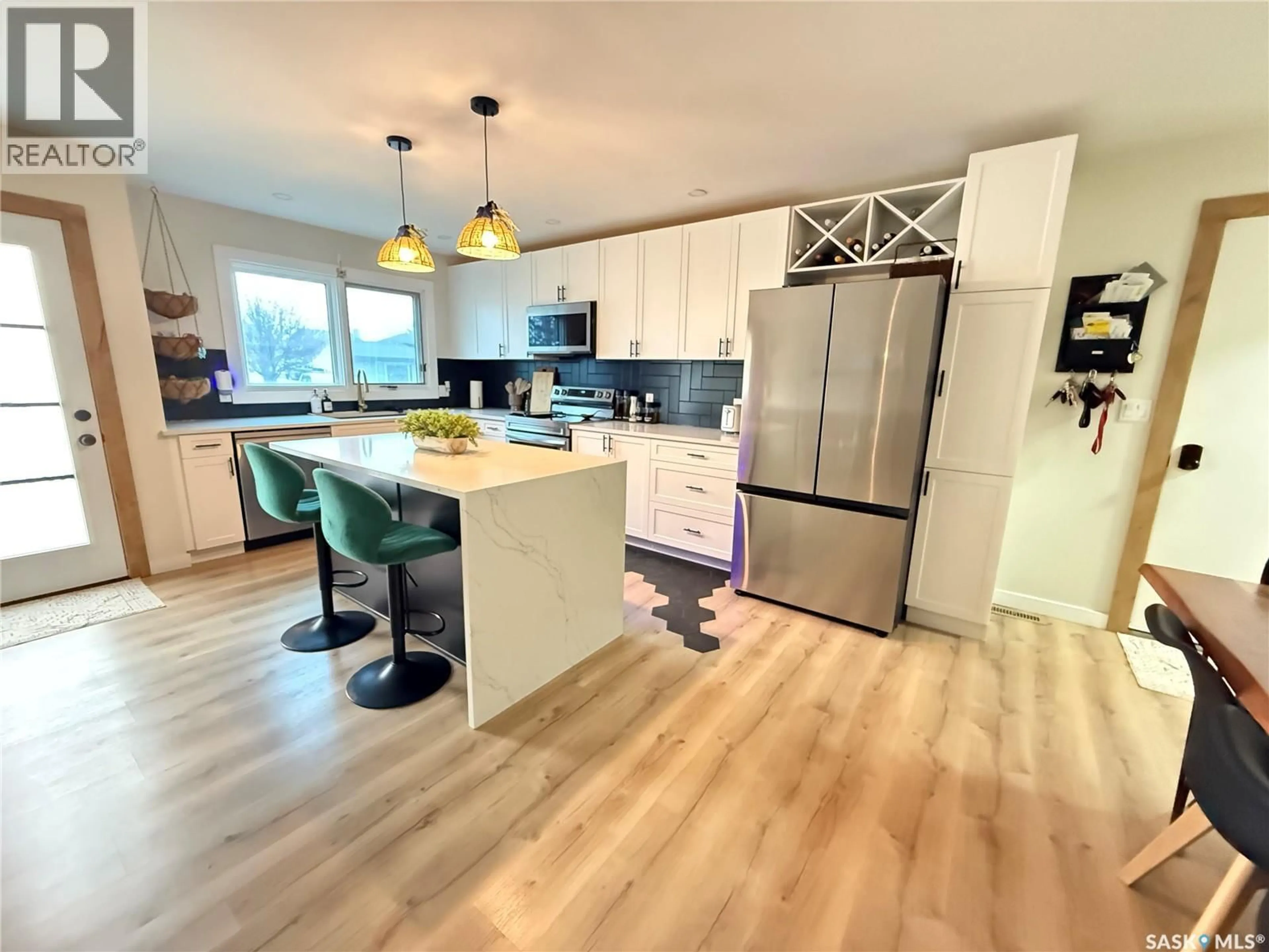 Open concept kitchen, wood/laminate floor for 409 BROOKS ROAD, Estevan Saskatchewan S4A2P2