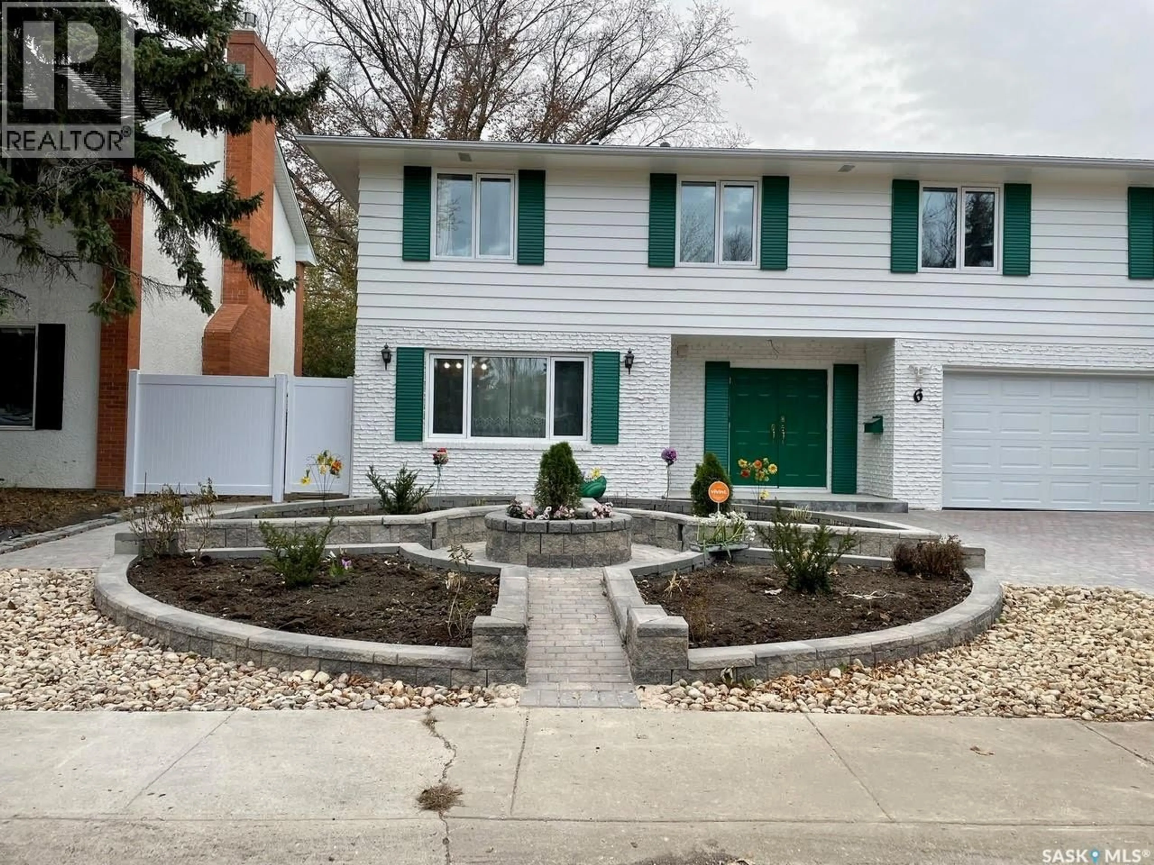 Home with vinyl exterior material, street for 6 HOGARTH PLACE, Regina Saskatchewan S4S4J8