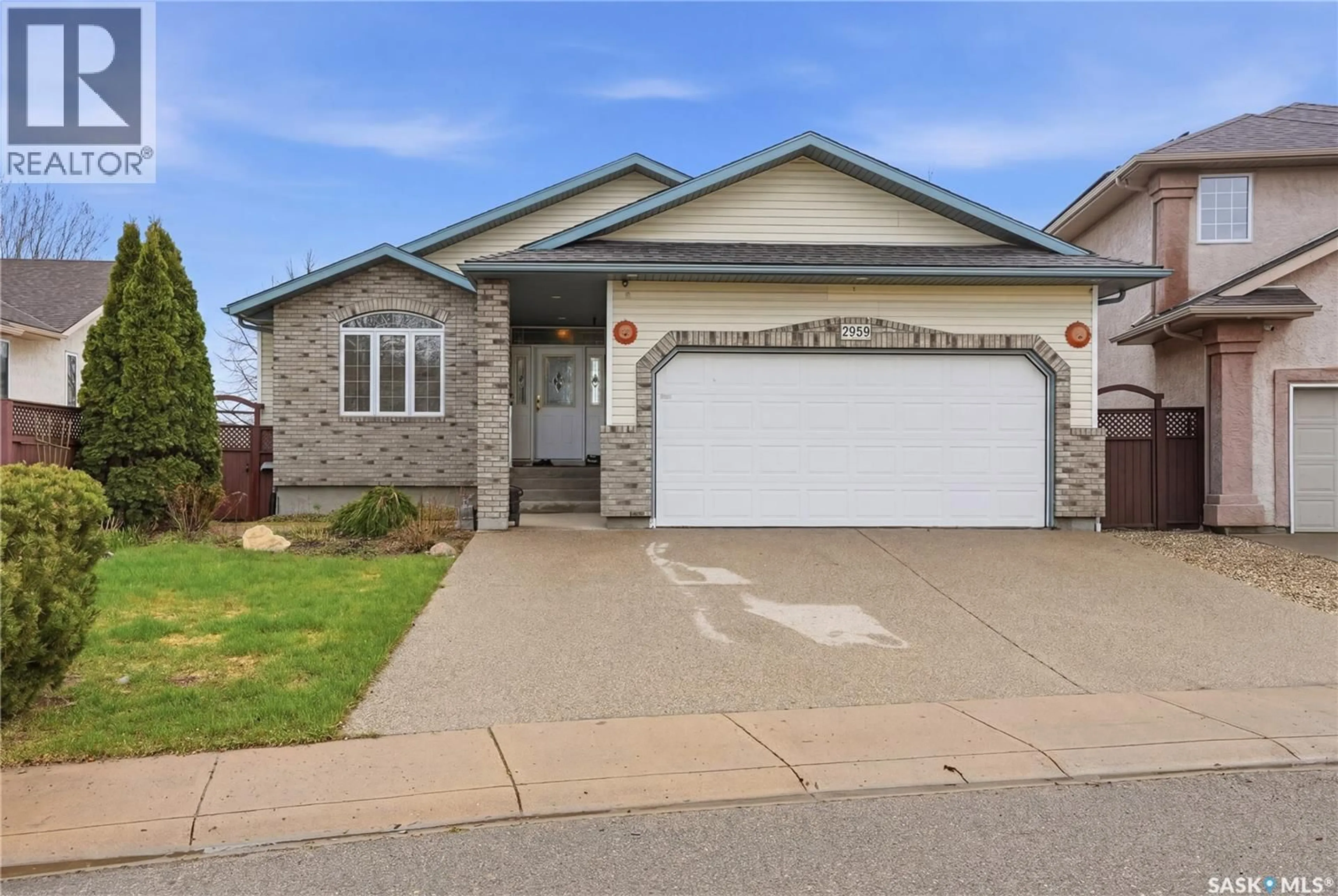 Home with vinyl exterior material, street for 5959 MALLARD WAY, Regina Saskatchewan S4T7X6
