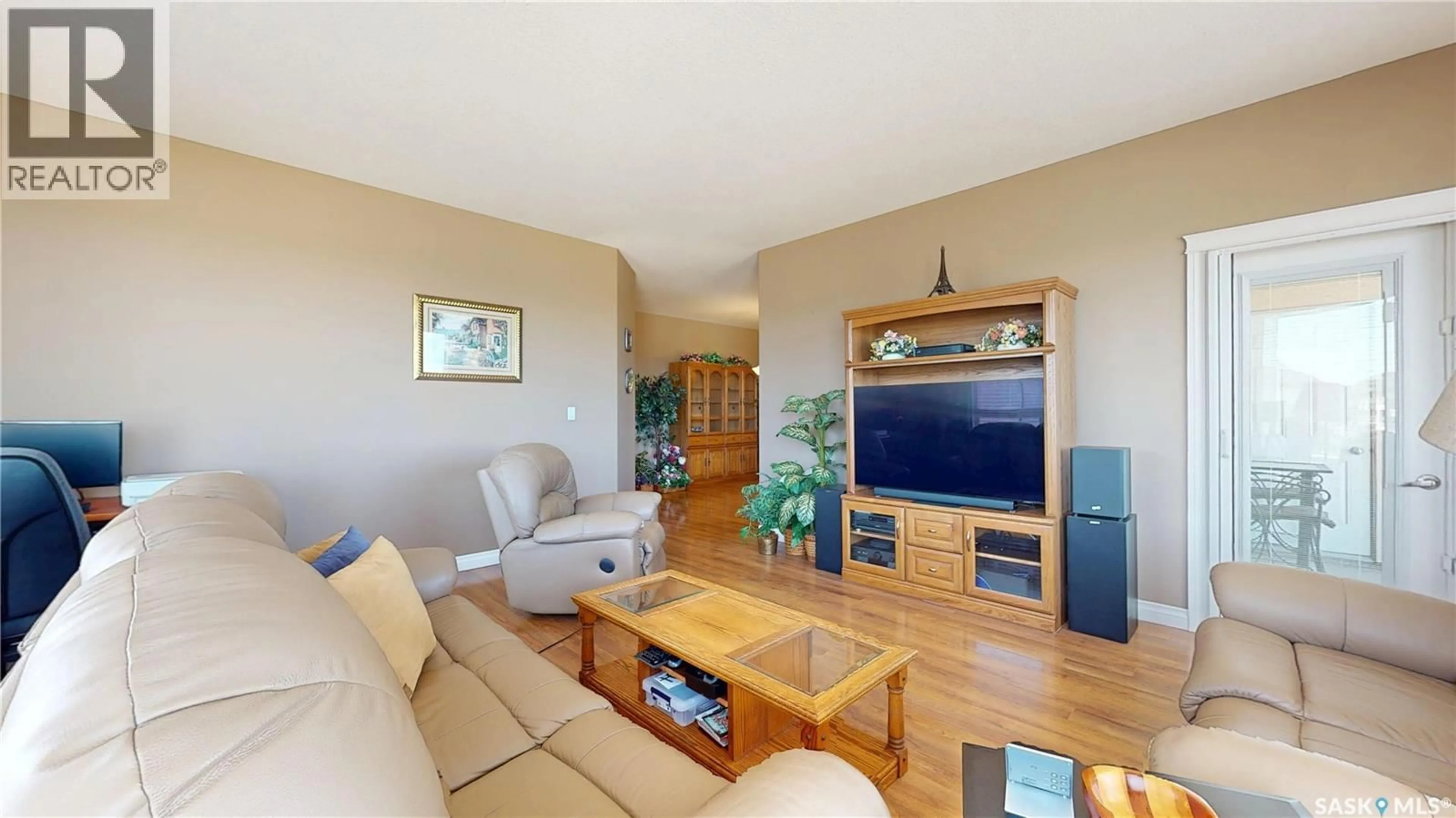 Living room with furniture, wood/laminate floor for 3750 HAUGHTON ROAD, Regina Saskatchewan S4V1R6