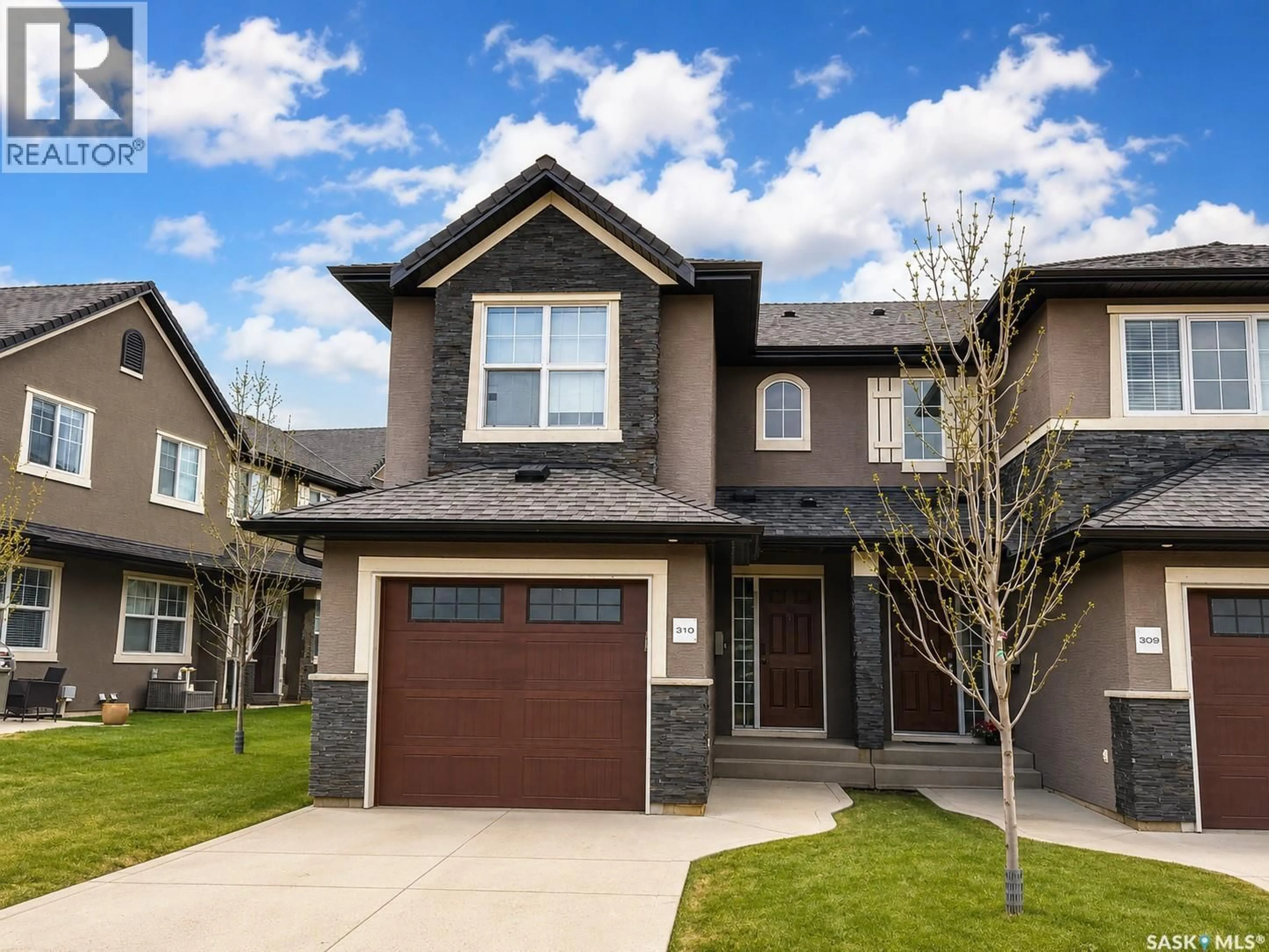 Home with vinyl exterior material, street for 310 - 1303 PATON CRESCENT, Saskatoon Saskatchewan S7W0B8
